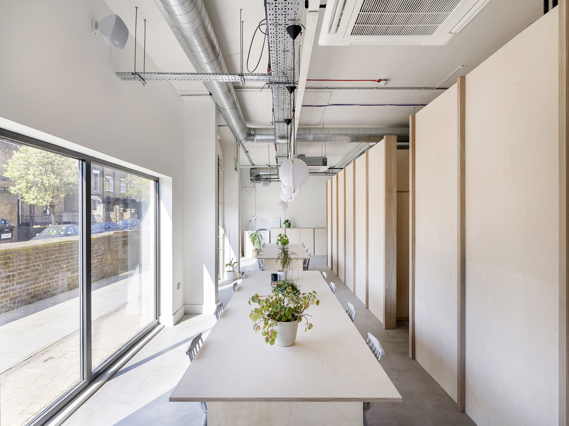 Modern meeting space with large windows for full venue hire at Arc Club. - Banner