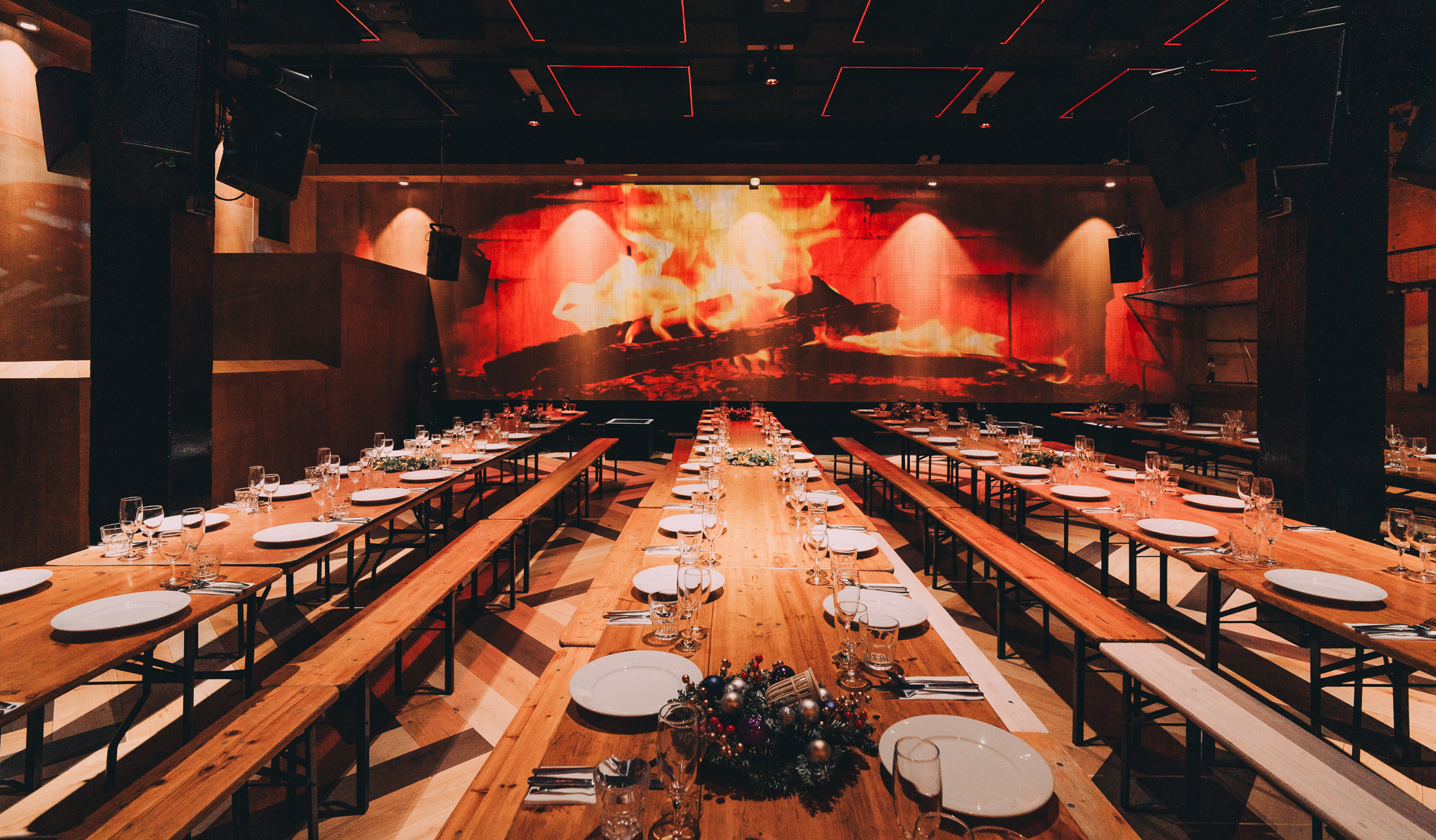 Stylish event space with long tables, ideal for Christmas dinners and networking in Hackney.