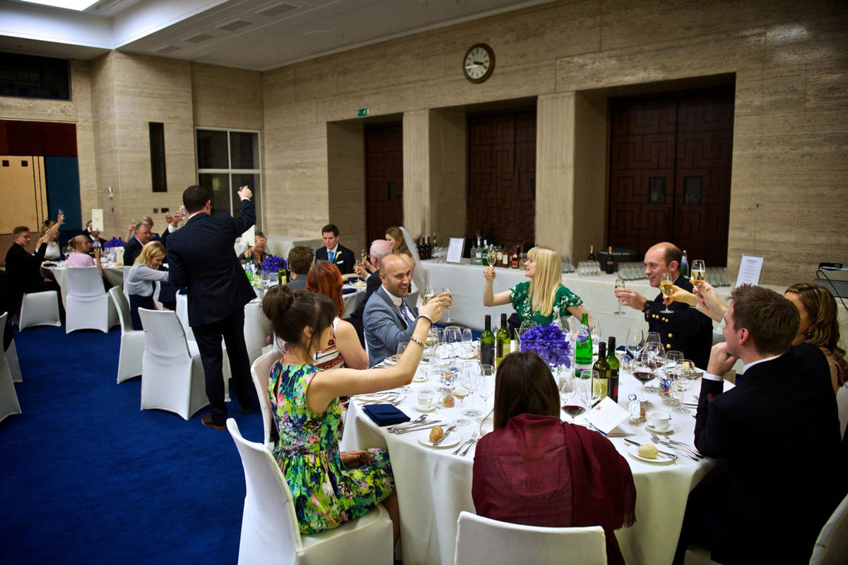 Elegant dinner event at MacMillan Hall, University of London, with floral centerpieces. - Banner