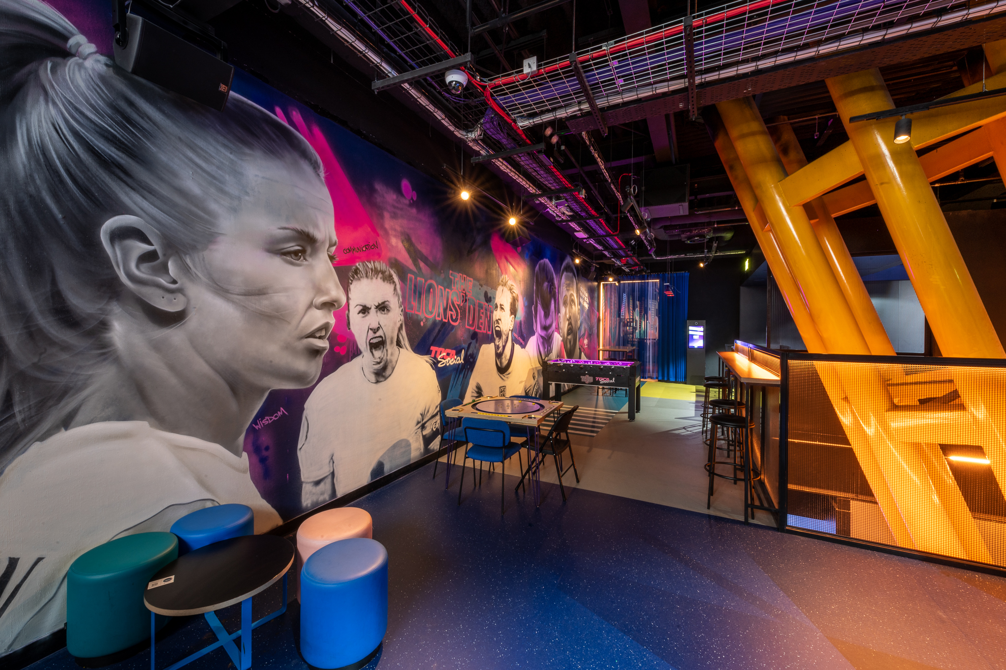 Executive Boxes at TOCA Social with vibrant wall art, ideal for team-building events.