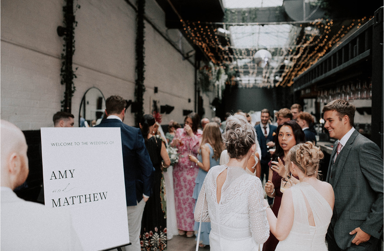 Vibrant wedding reception at Vennel in Box Hub with twinkling lights and elegant decor.