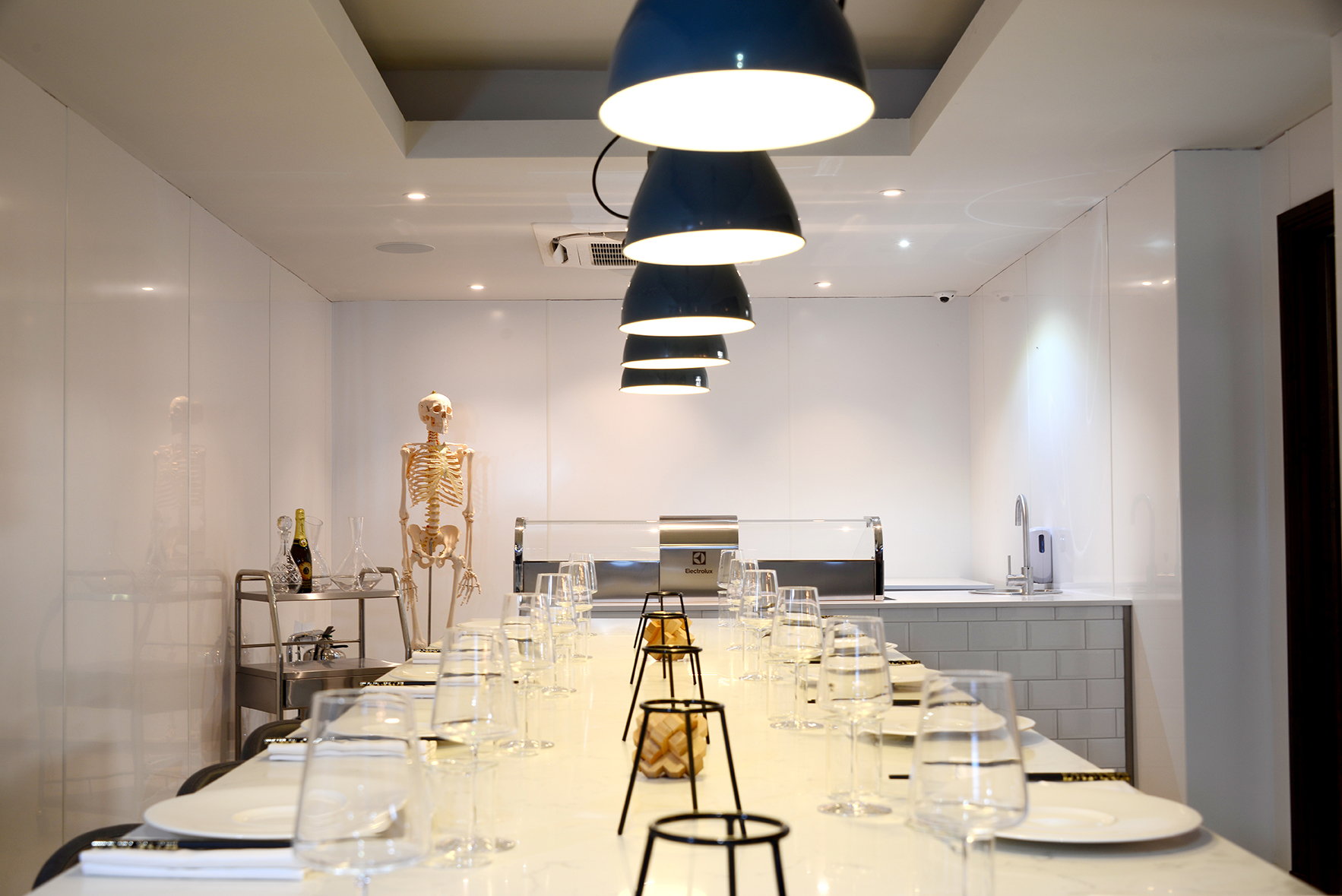 Modern dining space at Lu Ban Bar, featuring elegant table setup for themed events. - Banner