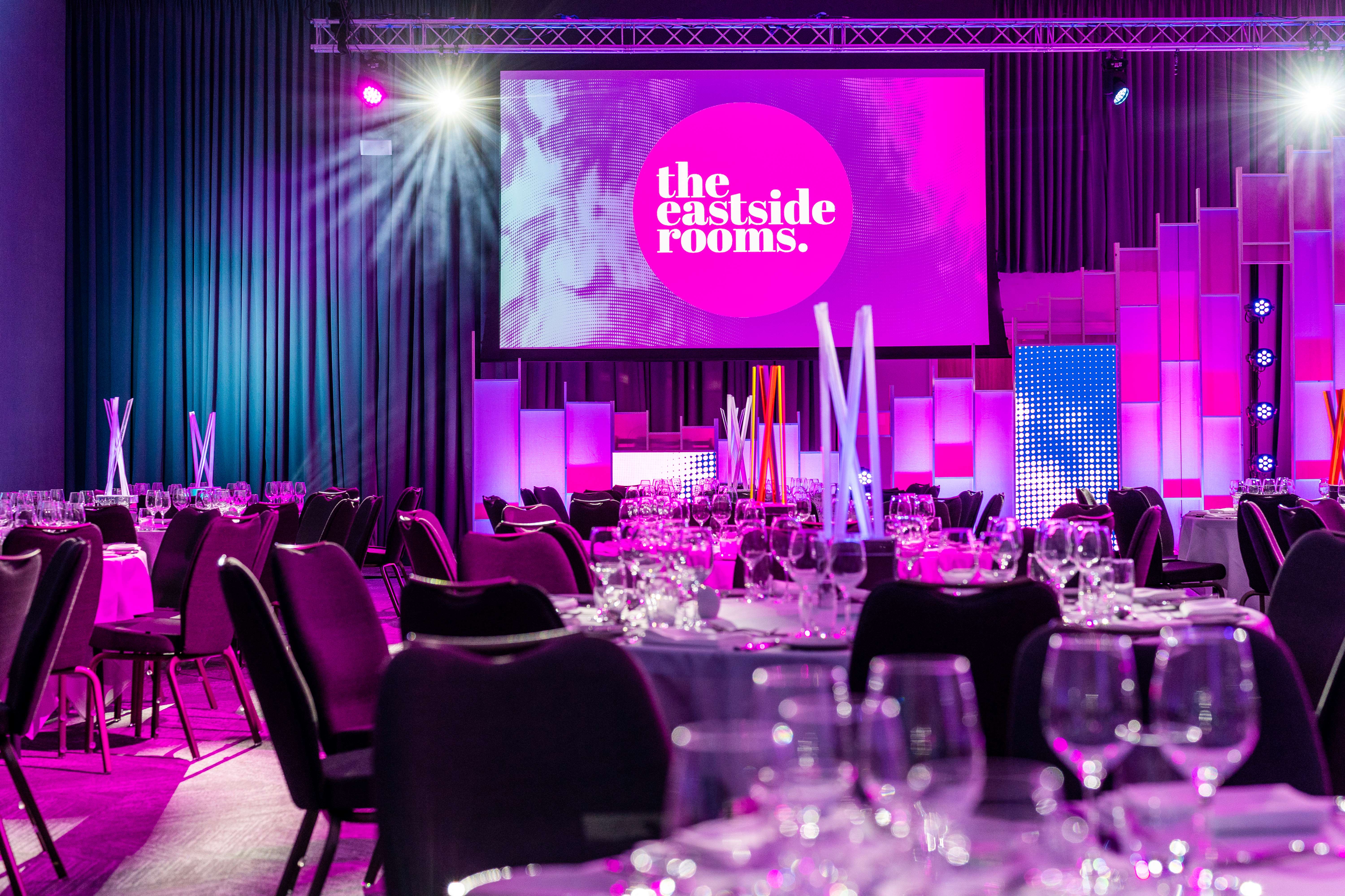 Affinity One event space with elegant tables, ideal for conferences and celebrations. - Banner