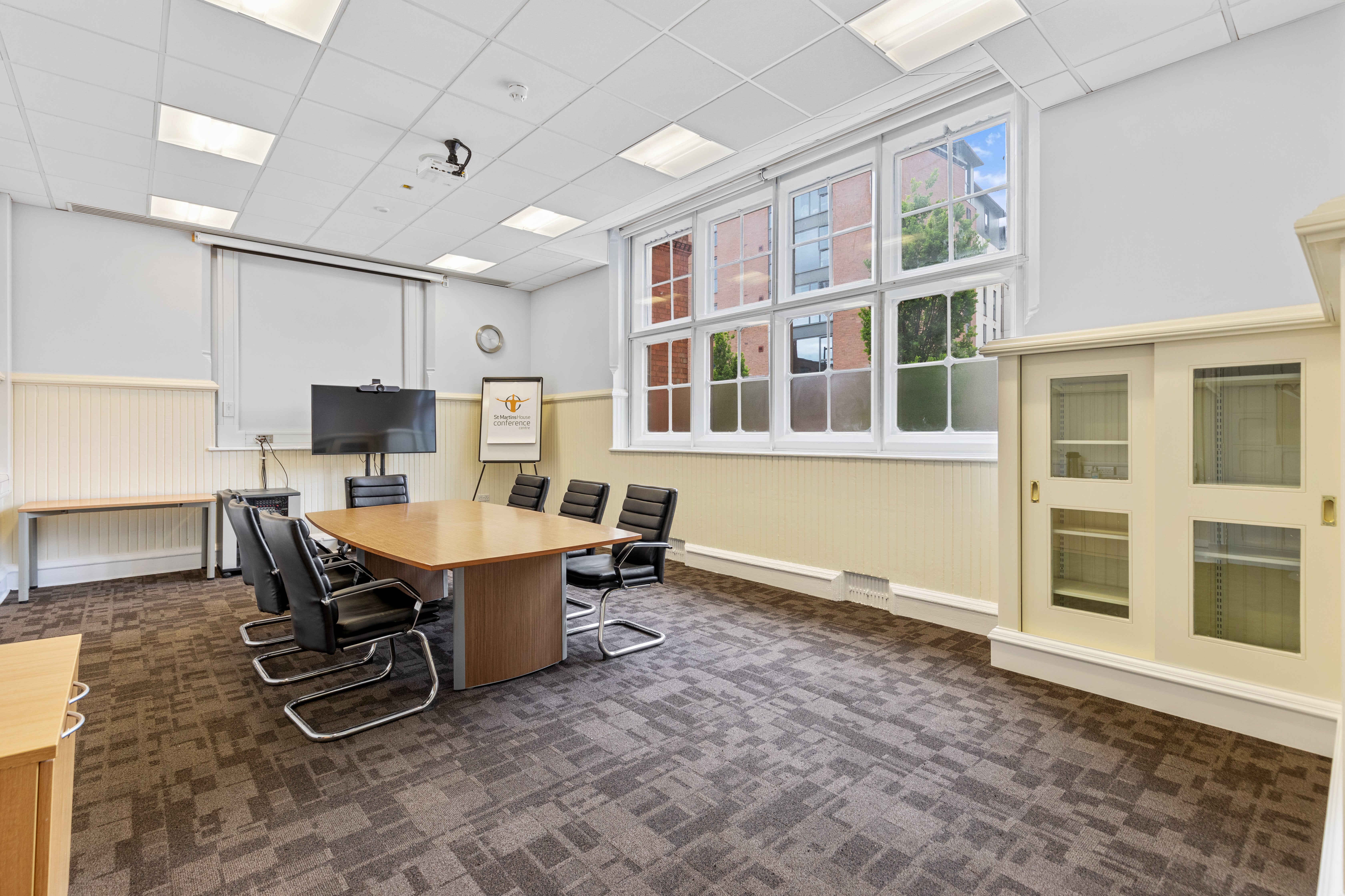 Heyrick Room at St Martins House: bright meeting space with large conference table.