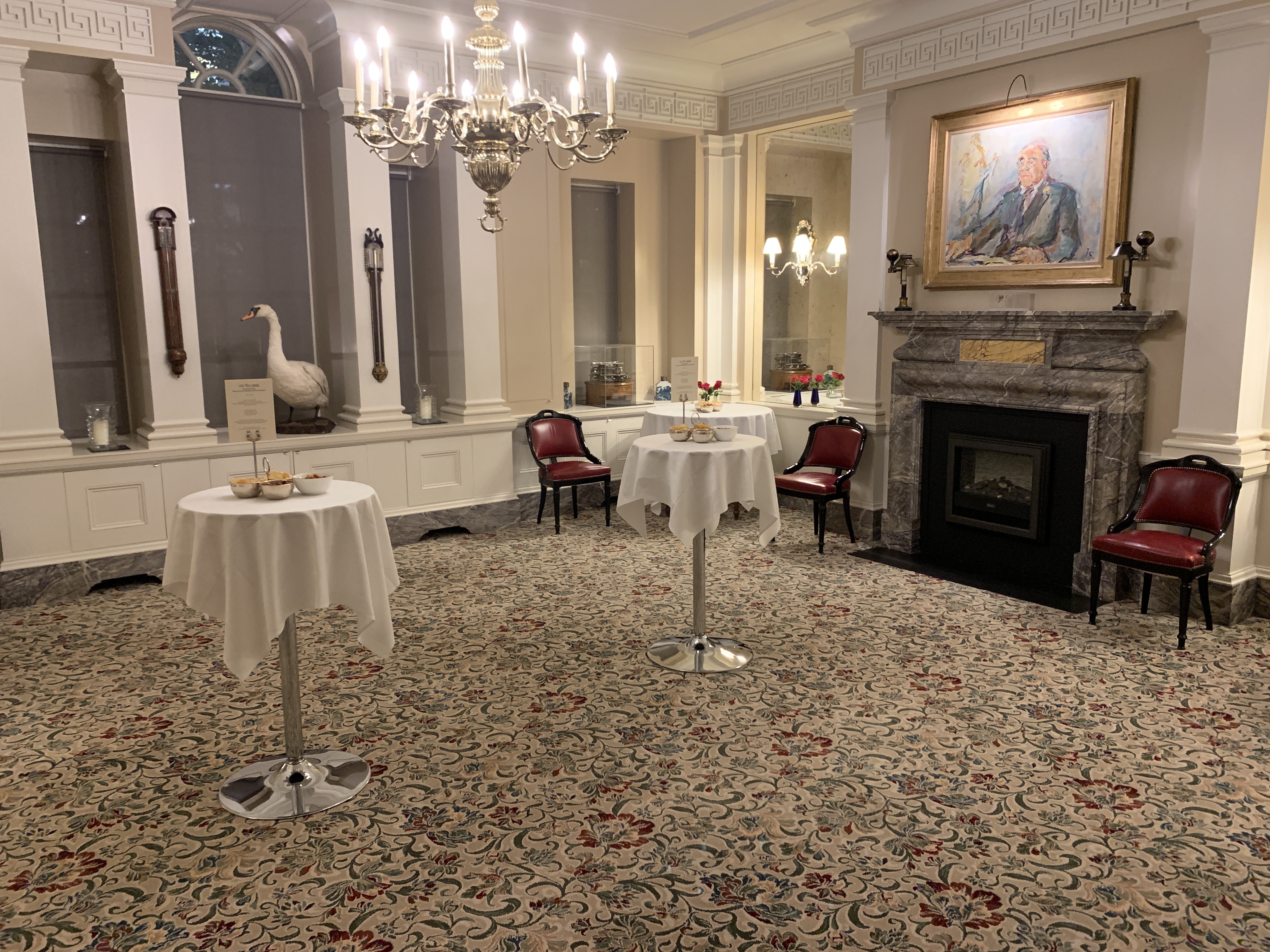 Main Dining Room at The Walbrook Club, elegant event space with chandelier, ideal for gatherings.