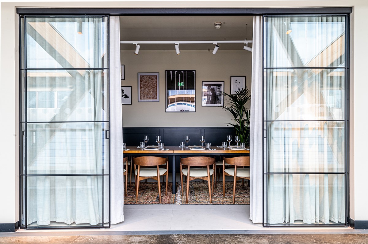 Private dining room with long table, ideal for corporate events and intimate gatherings.