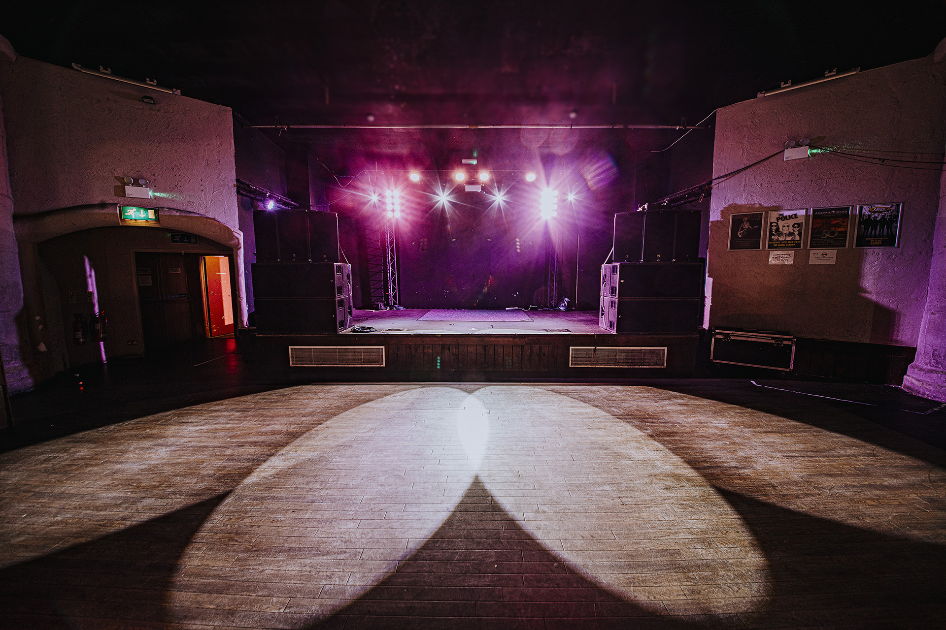 Main room at The Globe Cardiff with vibrant stage lighting for events and concerts.