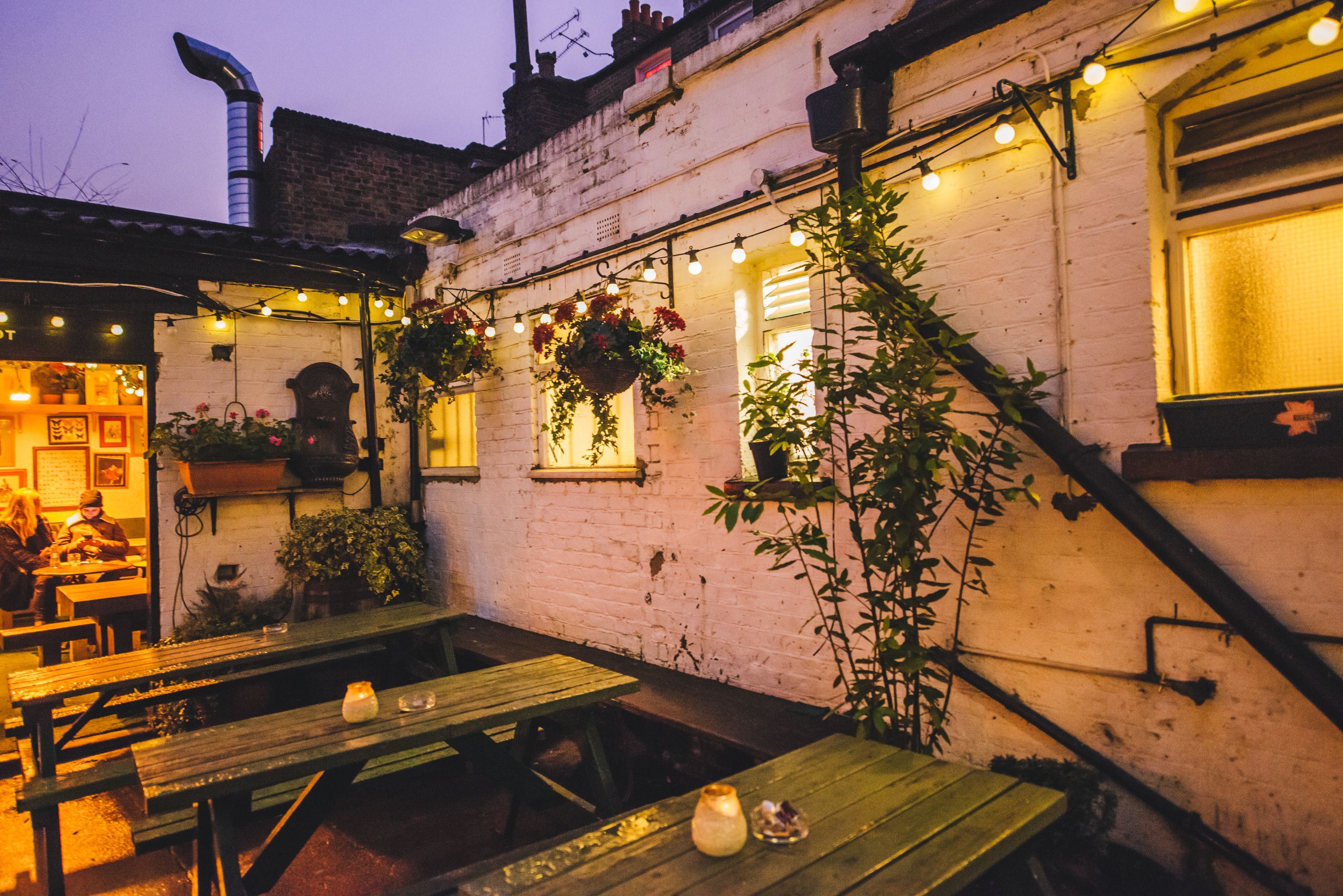 Charming outdoor venue at The Adam & Eve for networking and team-building events. - Banner