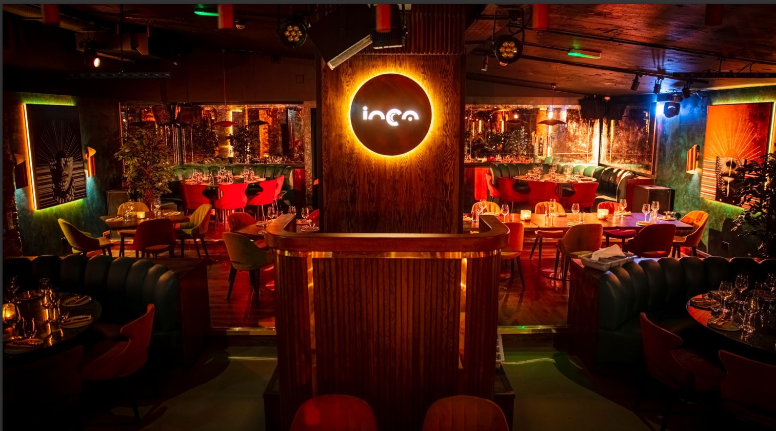 Vibrant LUNA LONDON restaurant with colorful seating, perfect for events and gatherings.