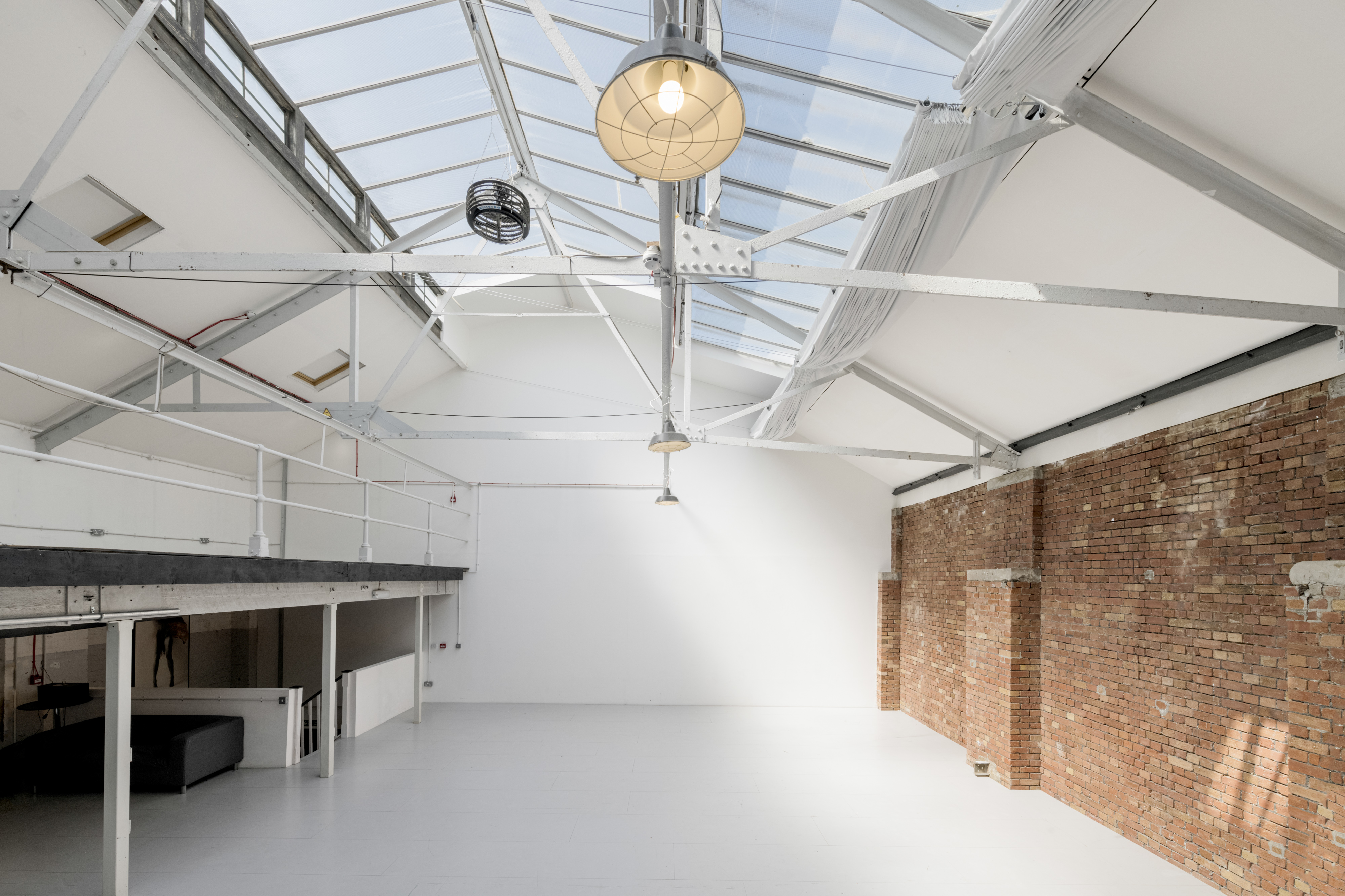 Spacious Heath Studio venue with high ceilings, perfect for corporate events and workshops. - Banner