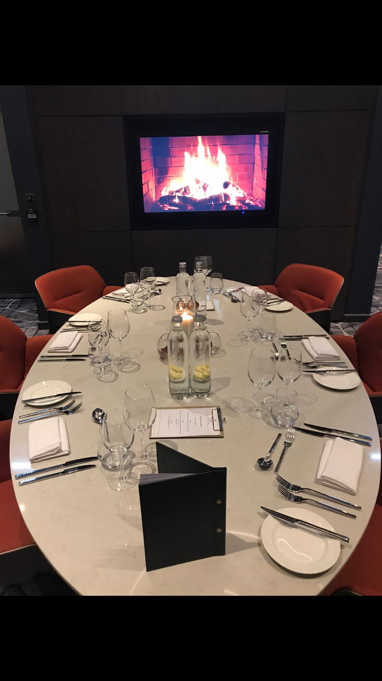 Elegant round dining table in The Turing Room, perfect for corporate dinners and networking.