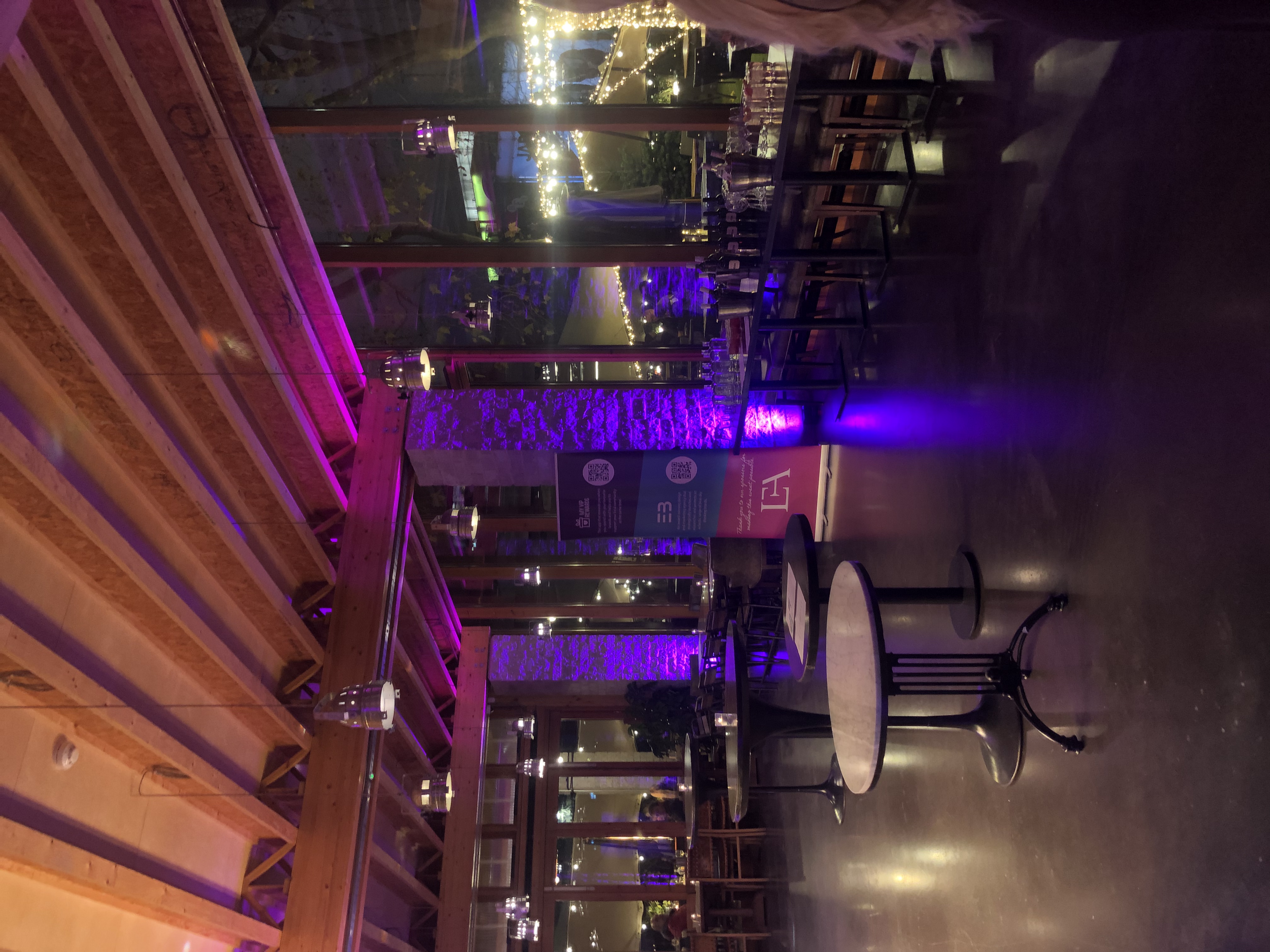 Stylish event space with ambient lighting, ideal for corporate gatherings and networking.