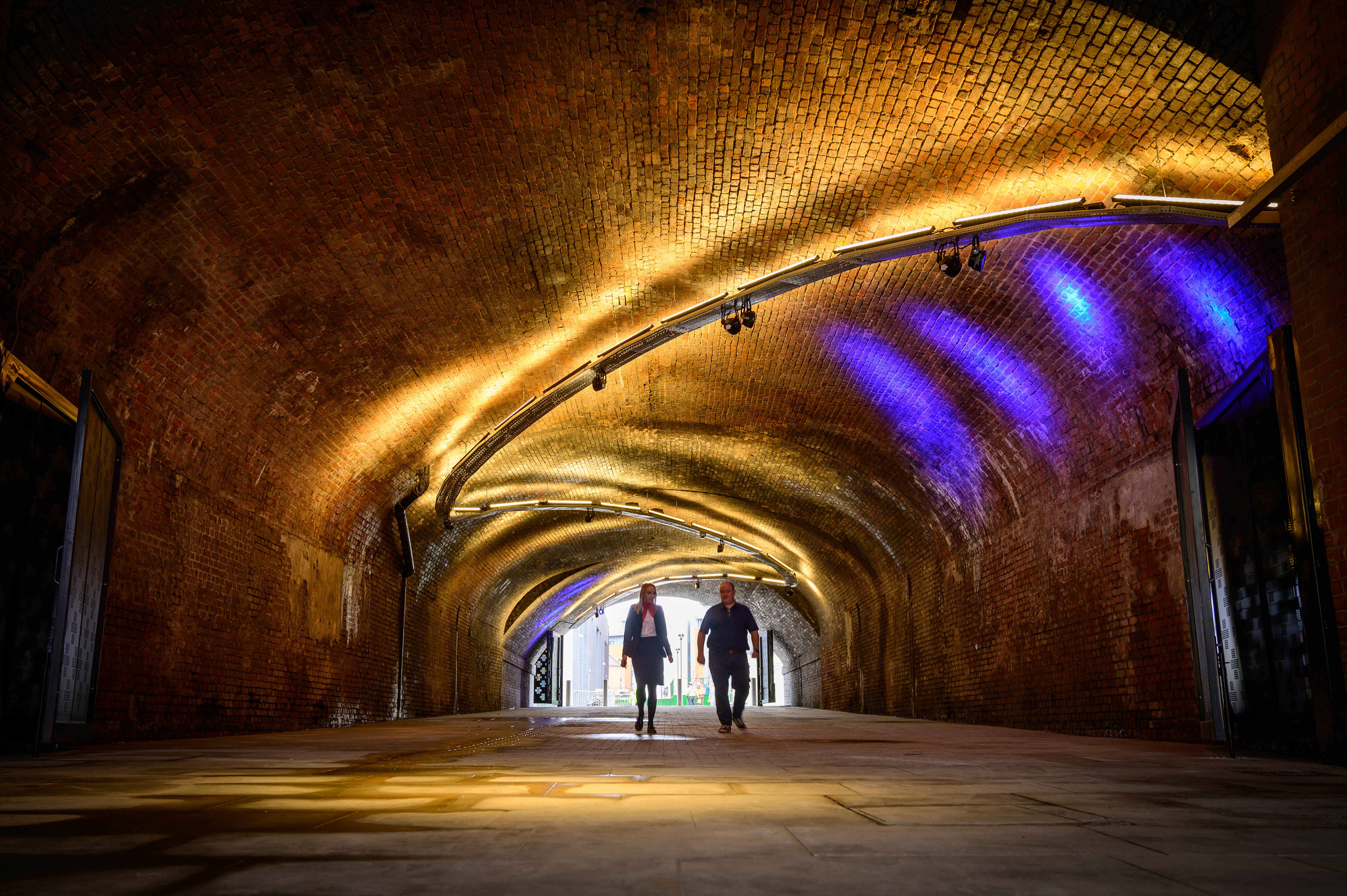 Spacious venue with arched brick ceiling, perfect for events and exhibitions. - Banner