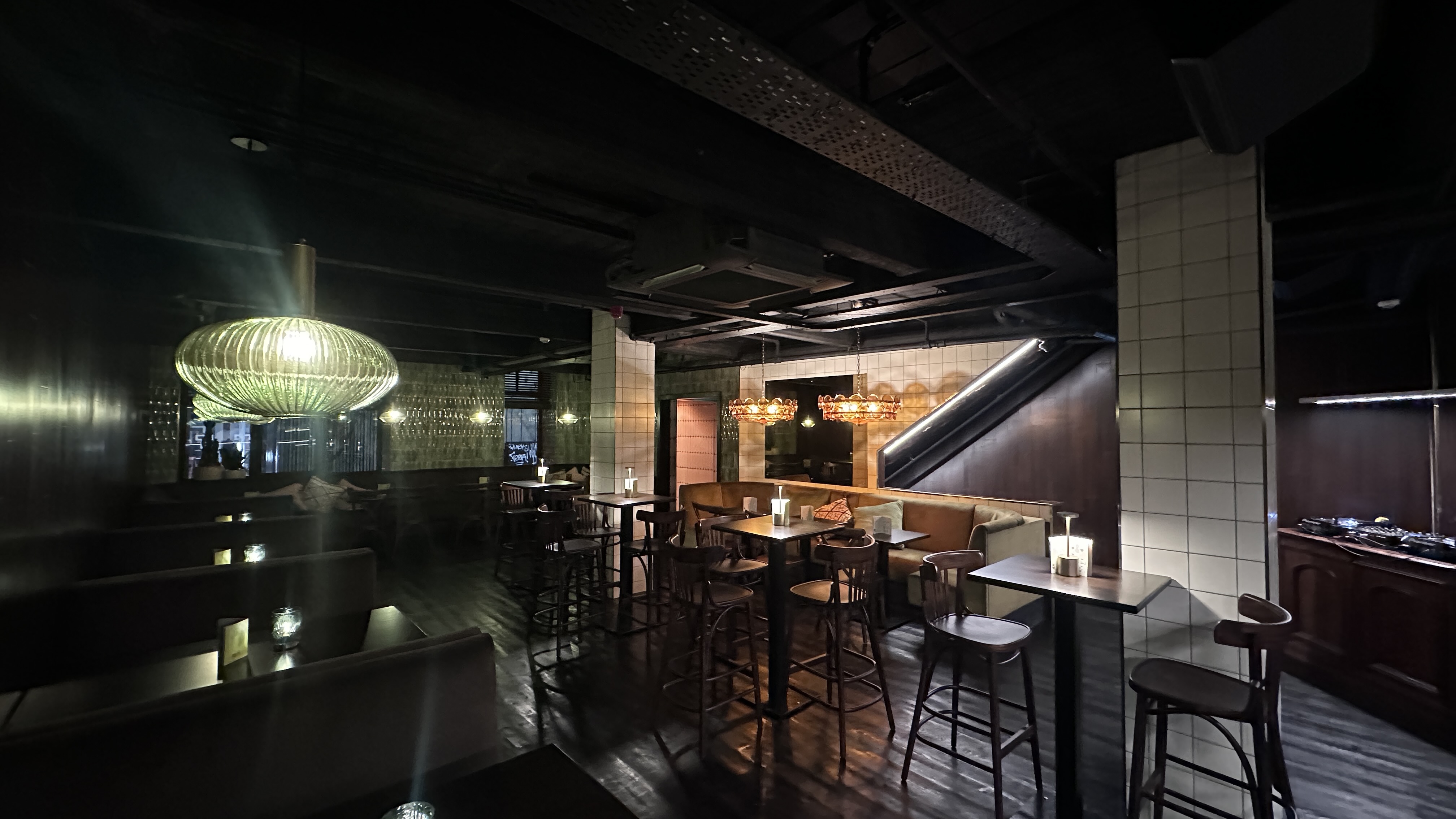 Stylish dimly lit venue for intimate gatherings and networking events in Boogalú.