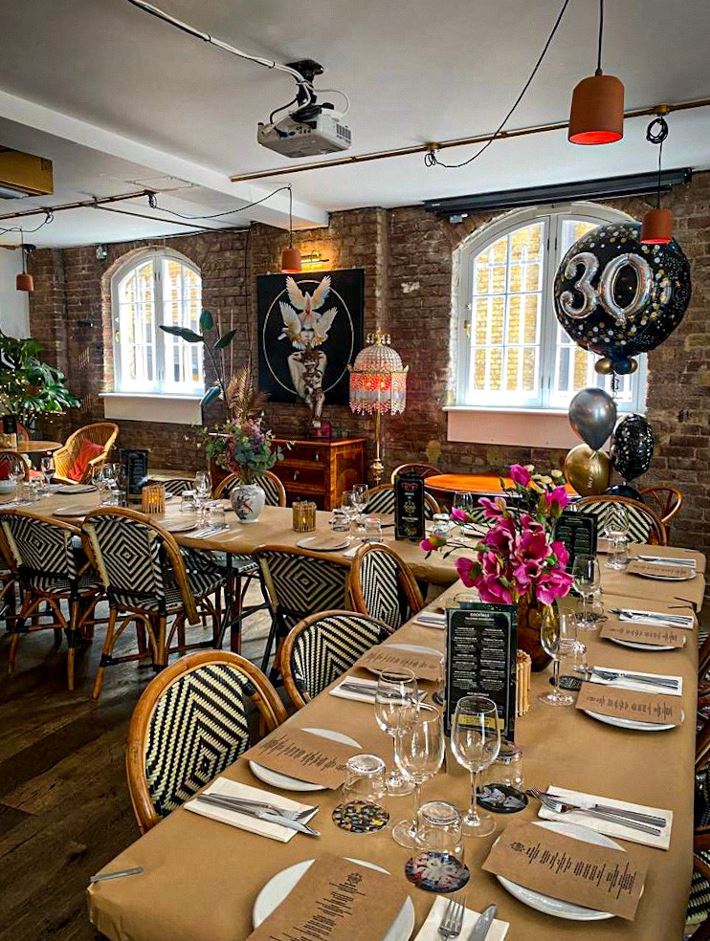 Elegant event space with floral centerpieces for milestone celebrations and anniversaries.