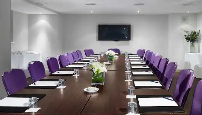 Pegasus and Phoenix Suite at Radisson Blu Hotel, Bristol - elegant meeting room with purple chairs. - Banner