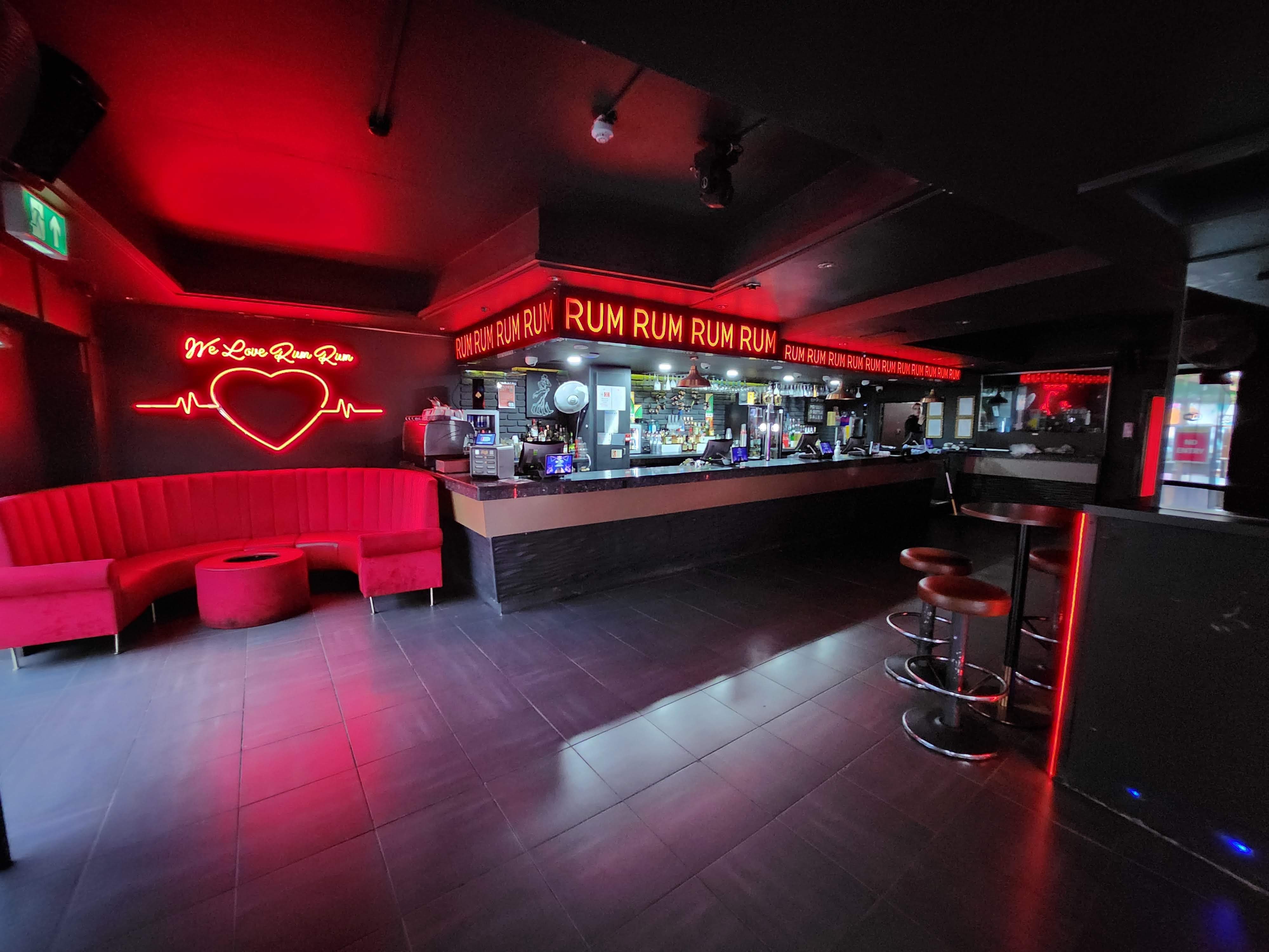Rum Rum Bar & NightClub in Birmingham with bold red lighting, perfect for social events.