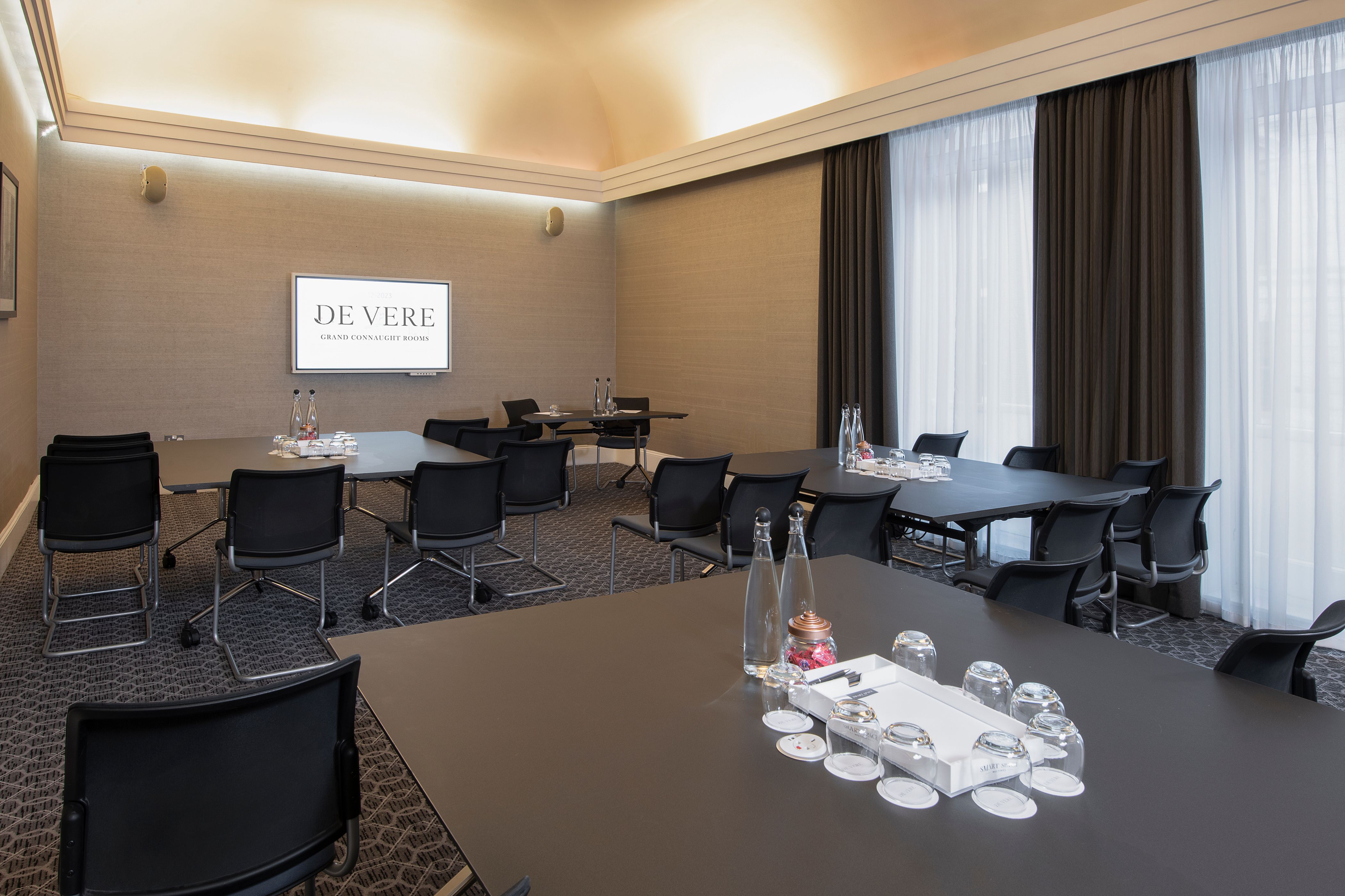 Oxford Suite meeting room with modern furnishings for professional events and presentations.