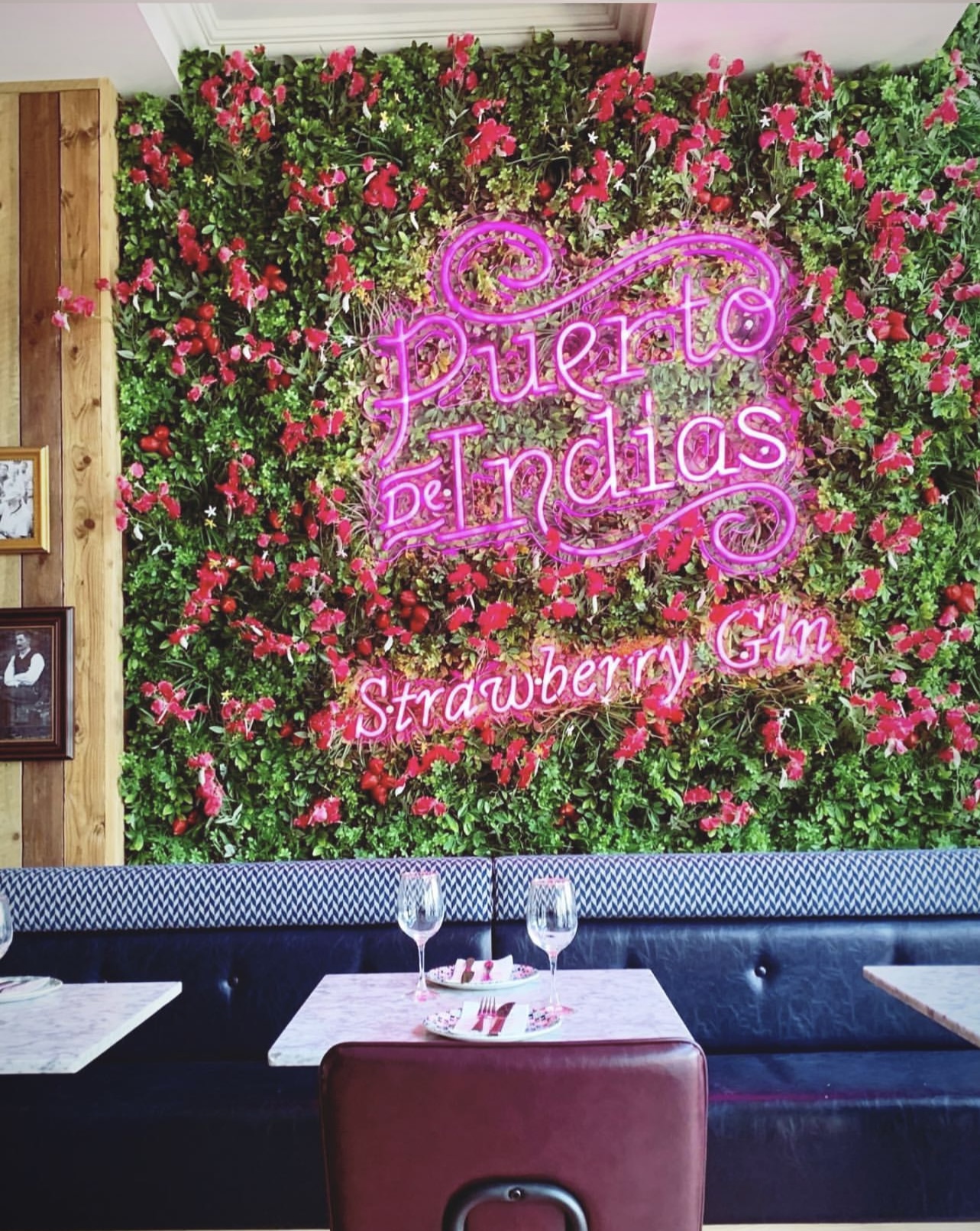 Tapas Revolution Restaurant with floral wall, ideal for cocktail receptions and themed events.