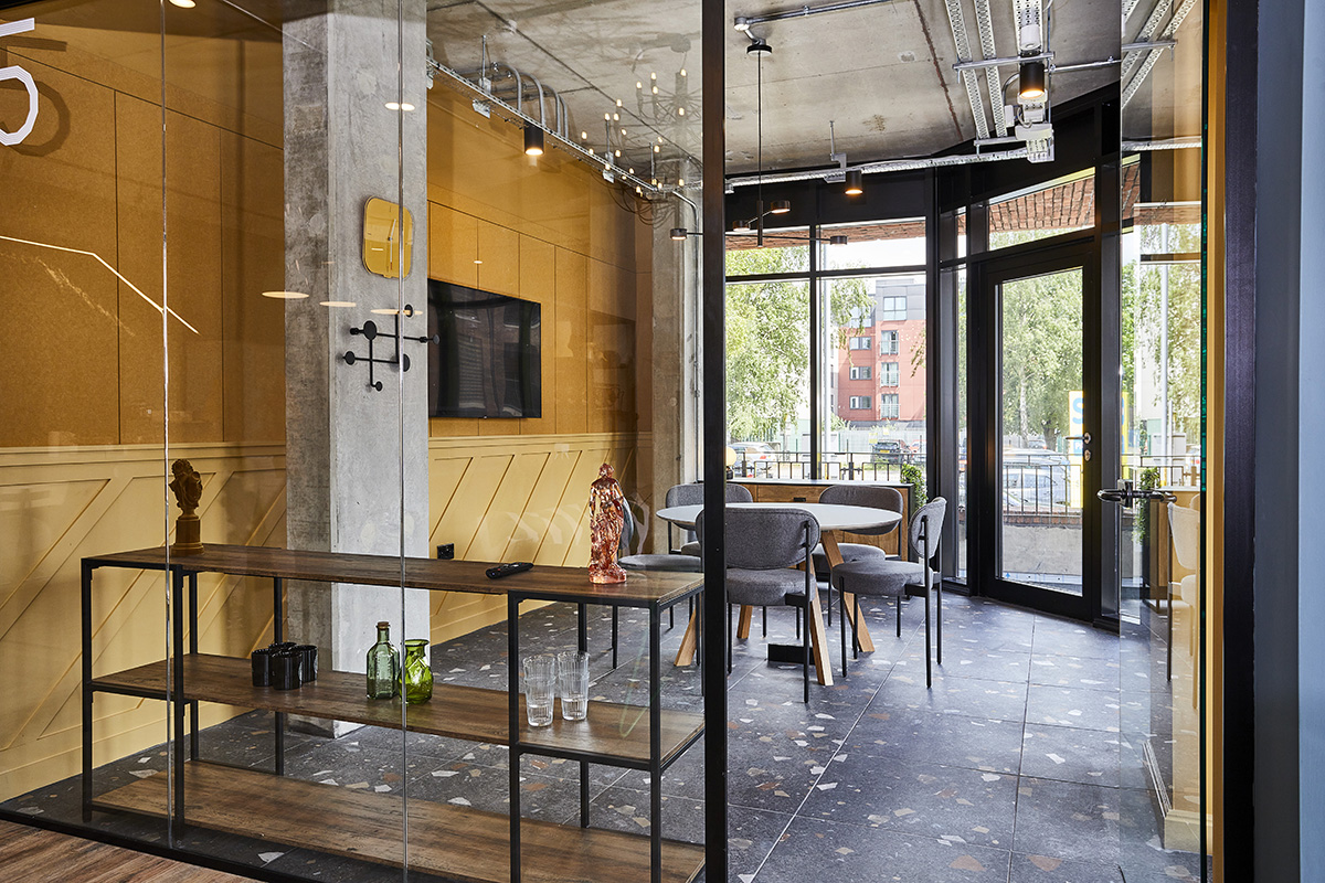 Modern meeting space with large windows, ideal for collaborative events and client meetings.