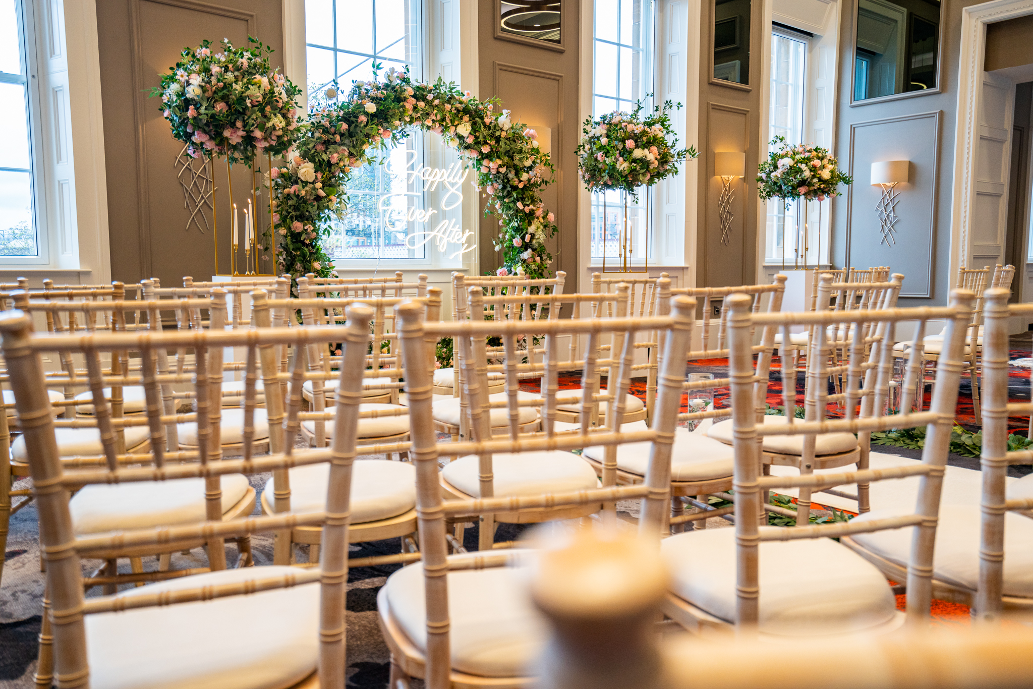 Custom House event space with chiavari chairs, perfect for weddings and gatherings.