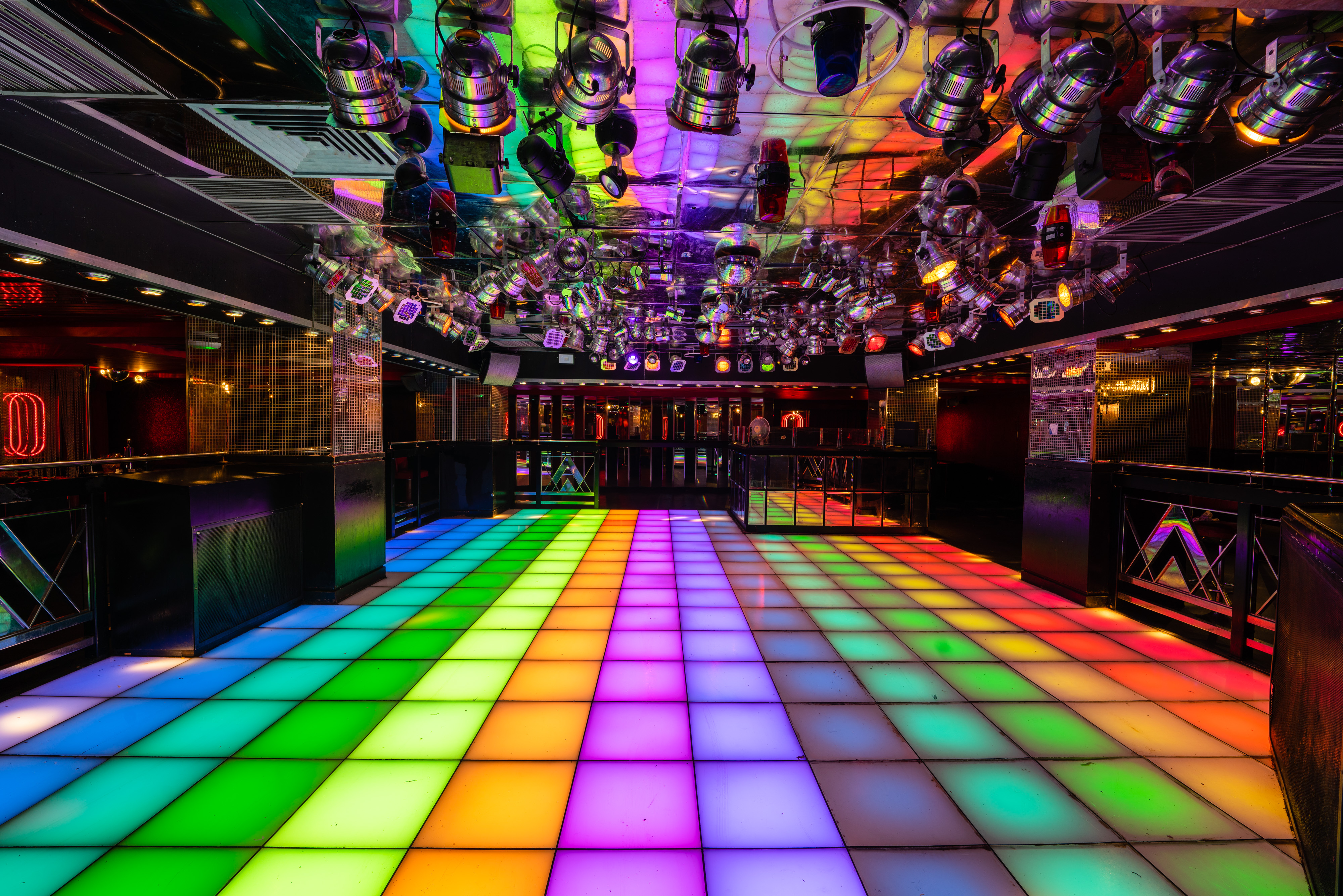Vibrant Disco event space with LED dance floor and mirrored ceiling in Pryzm Brighton.