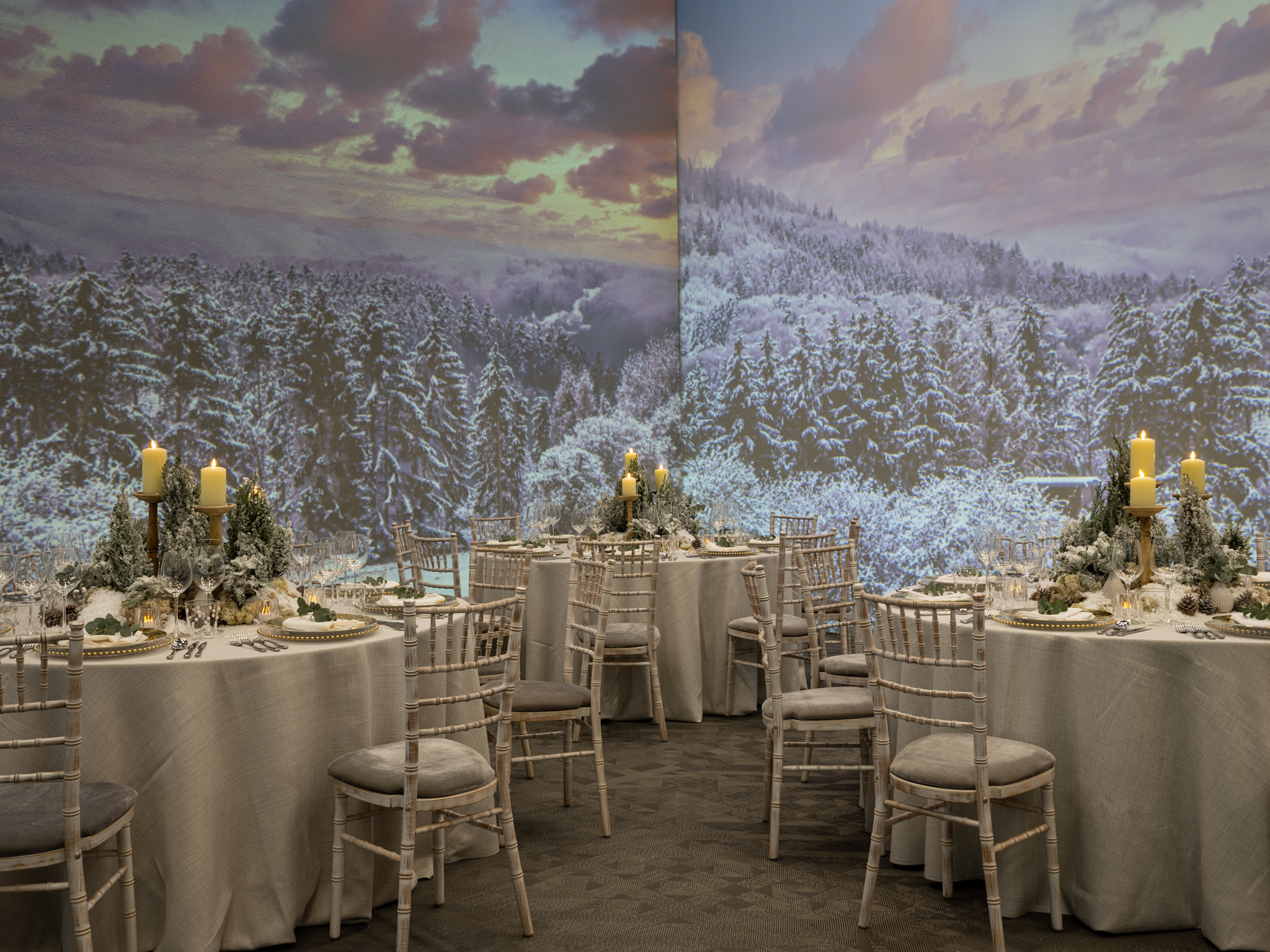 Elegant banquet space with round tables, perfect for winter events and holiday gatherings.