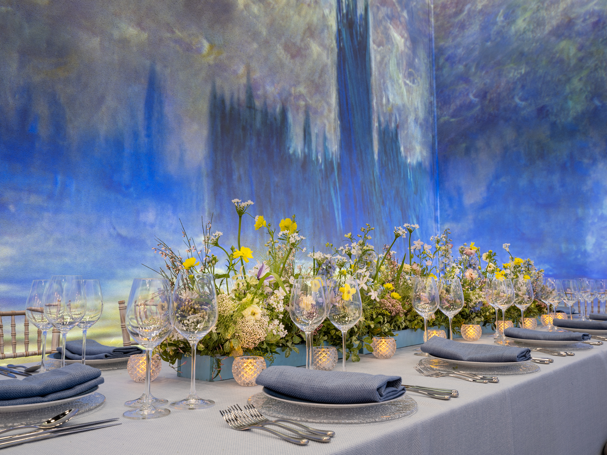 Elegant dining table with floral arrangements for upscale events and intimate gatherings. - Banner