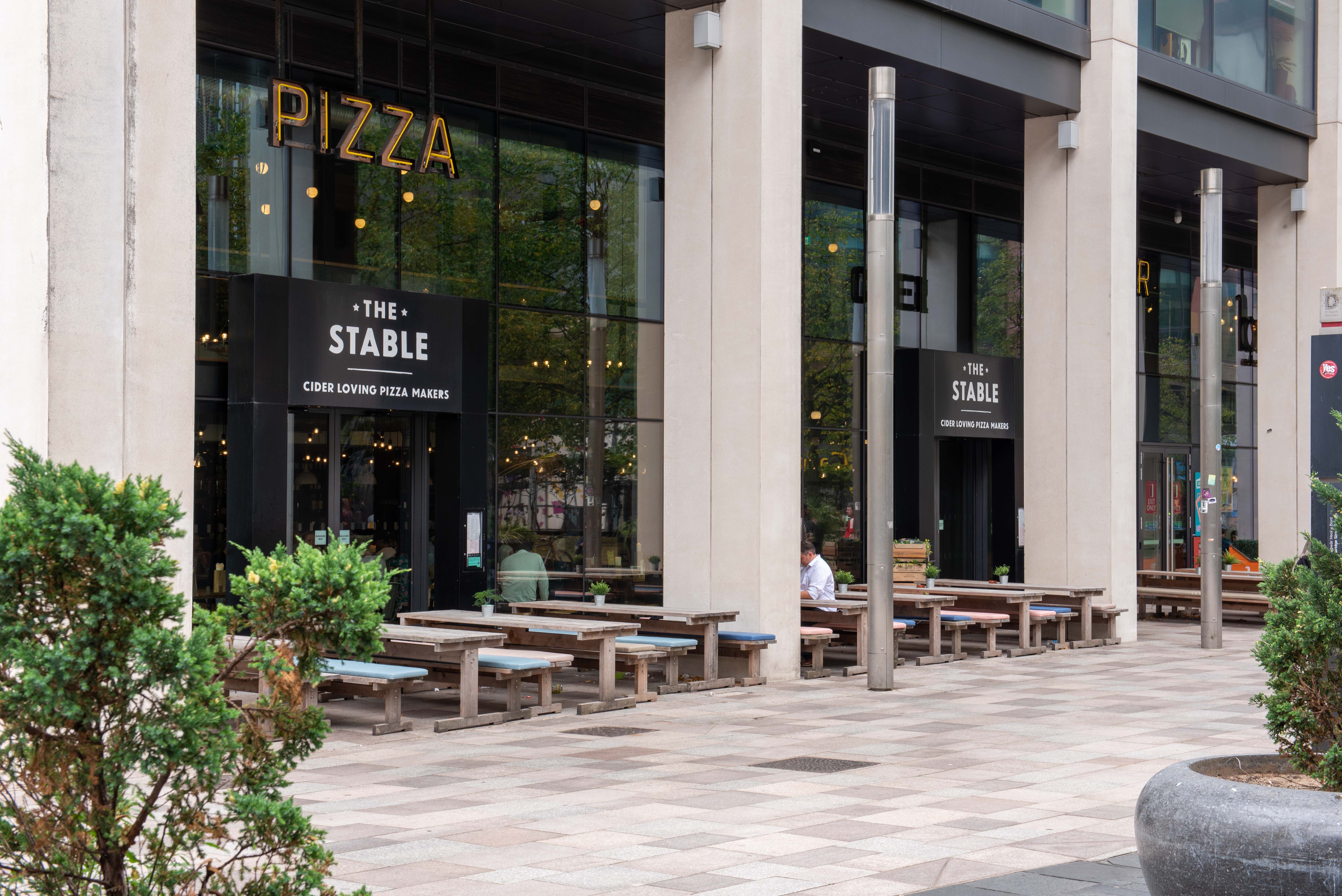 Outdoor dining area at The Cardiff Stable, perfect for casual meetings and events.