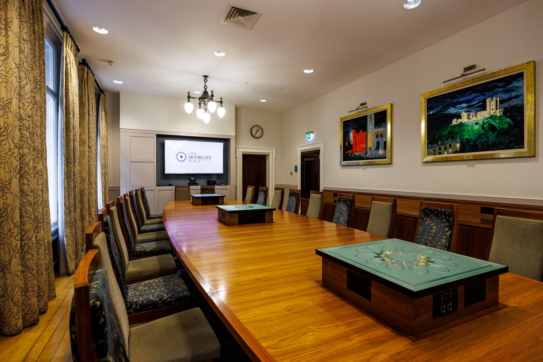 Boardroom at One Moorgate Place with wooden table, ideal for meetings and presentations. - Banner