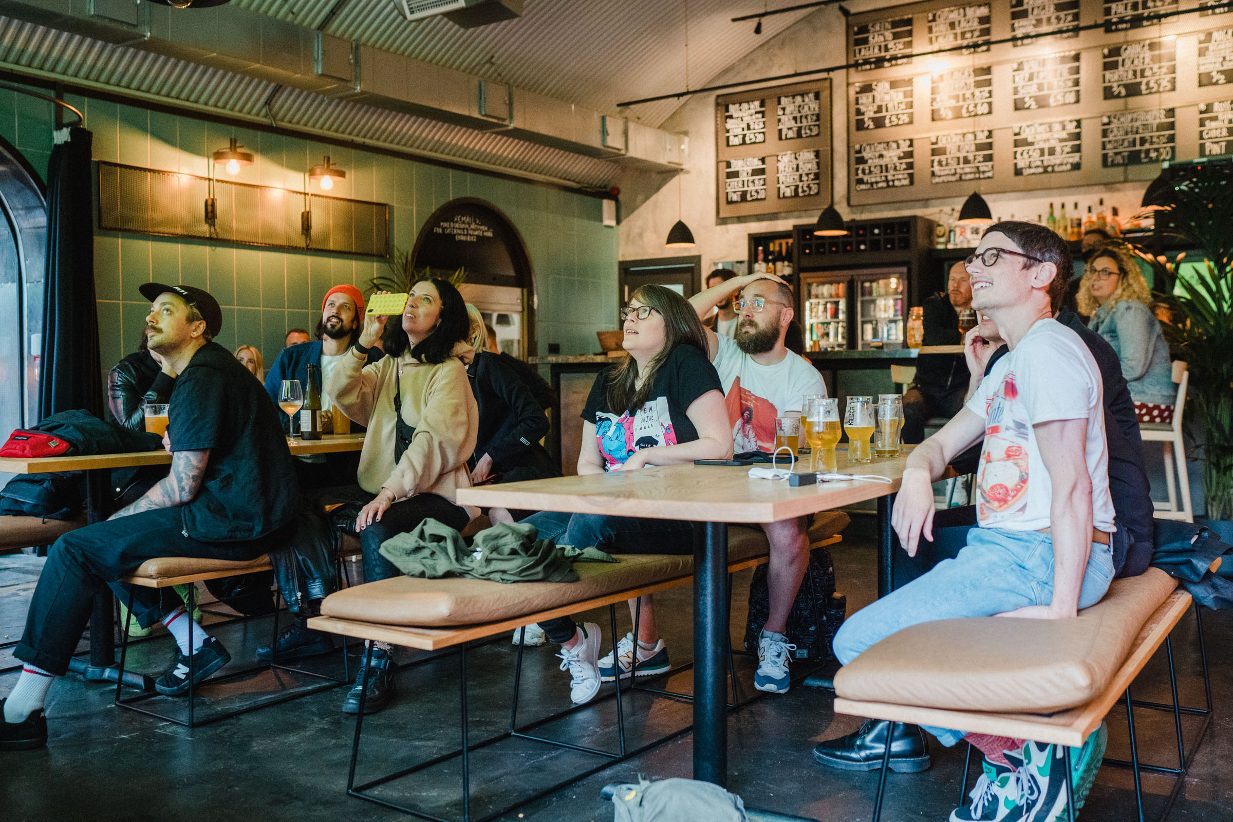 Diverse attendees in casual meeting at Kilder Bar, ideal for networking and collaboration. - Banner