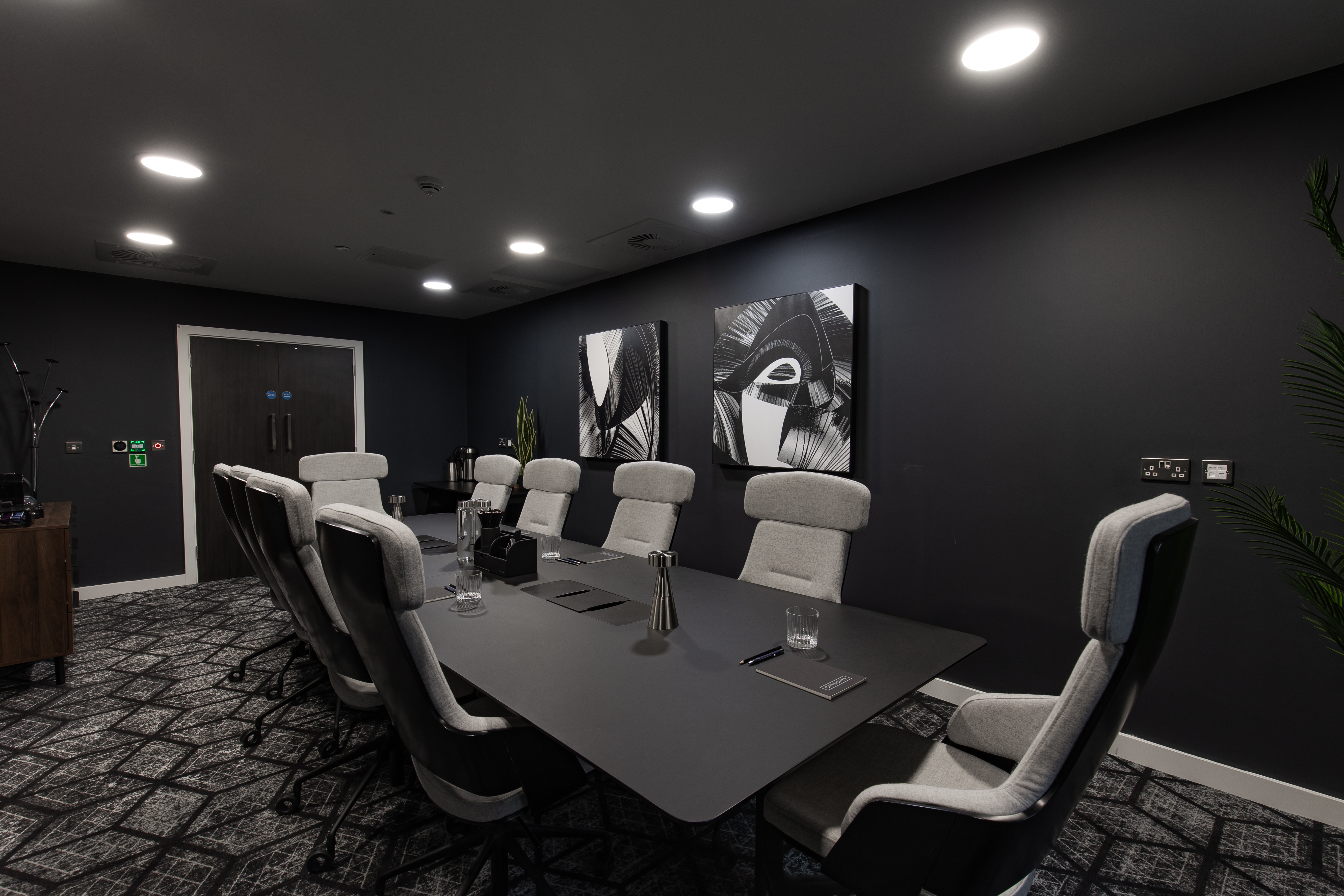 Modern conference room with ergonomic chairs for productive meetings at CitySuites II. - Banner