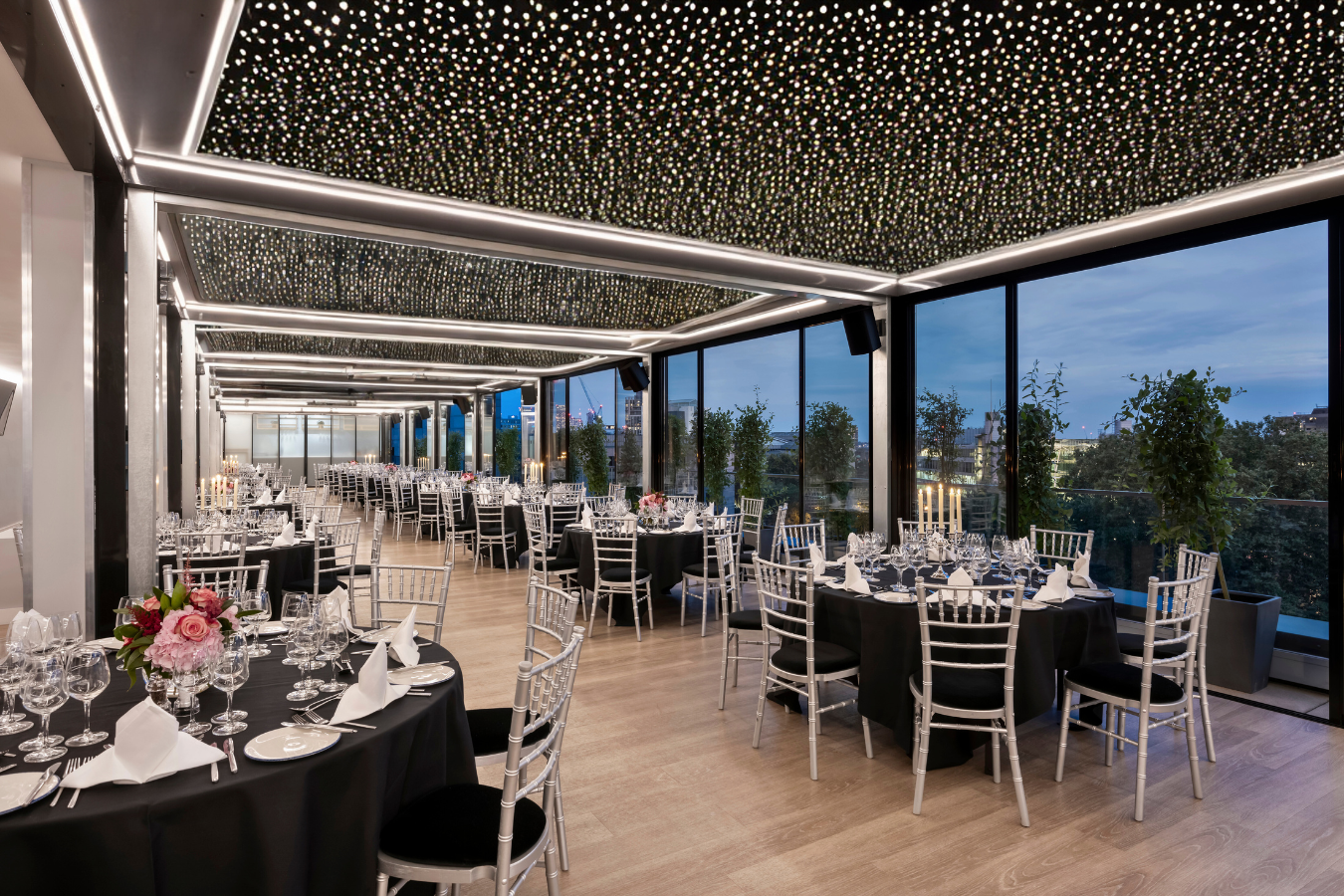Blue Orchid Hotel rooftop ballroom with fiber-optic ceiling for corporate gala and Christmas party.