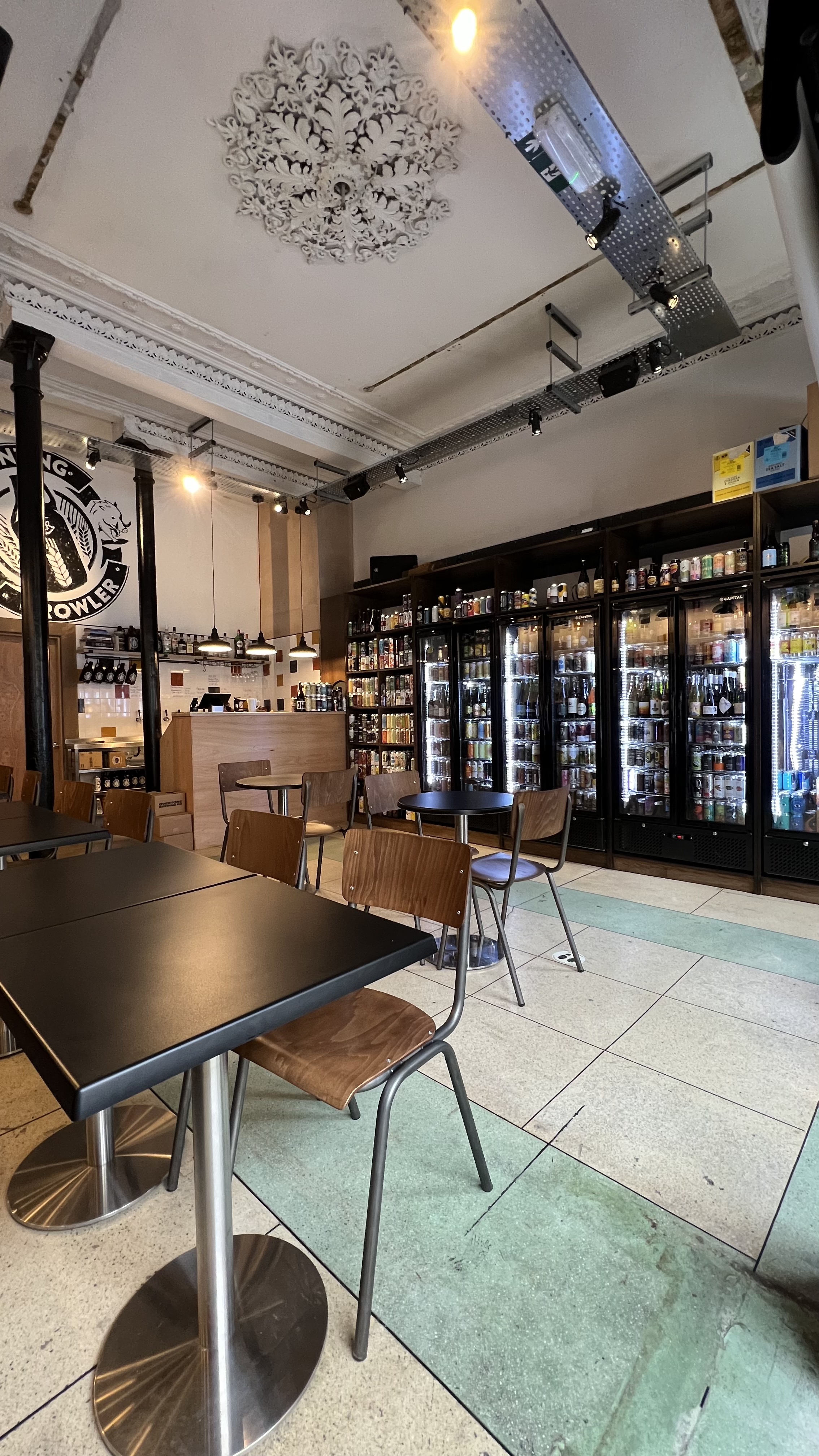 Cozy Grunting Growler venue with sleek bar, ideal for informal meetings and small events. - Banner