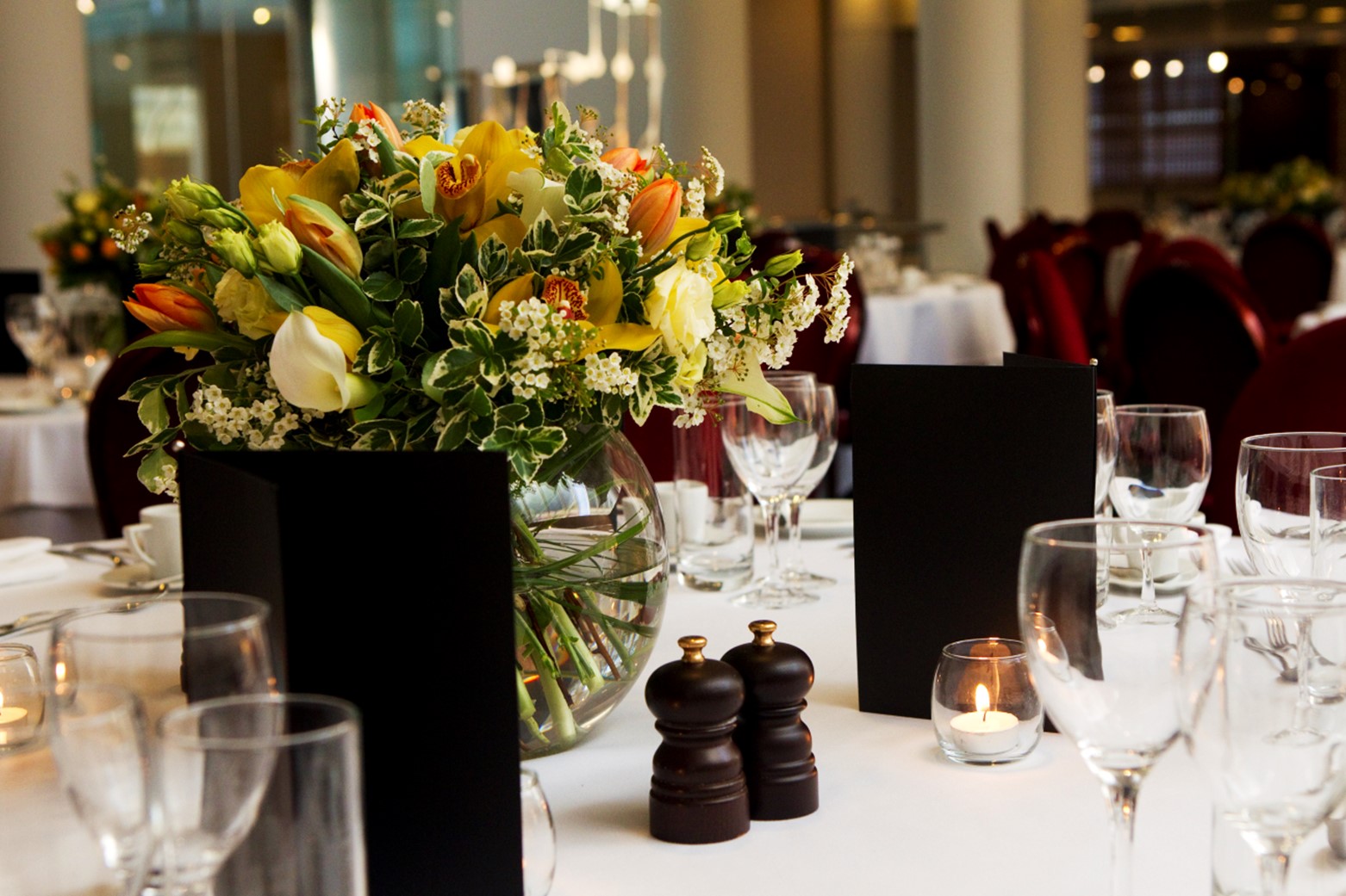 Elegant dining table with floral centerpiece for formal events at Cavendish Room.