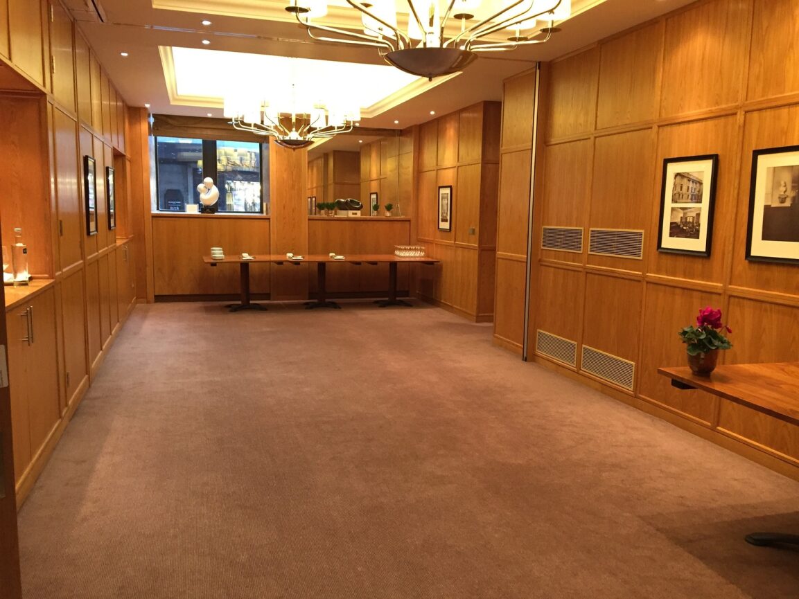 Private dining room at 1 Wimpole Street, featuring warm wood paneling for corporate events.