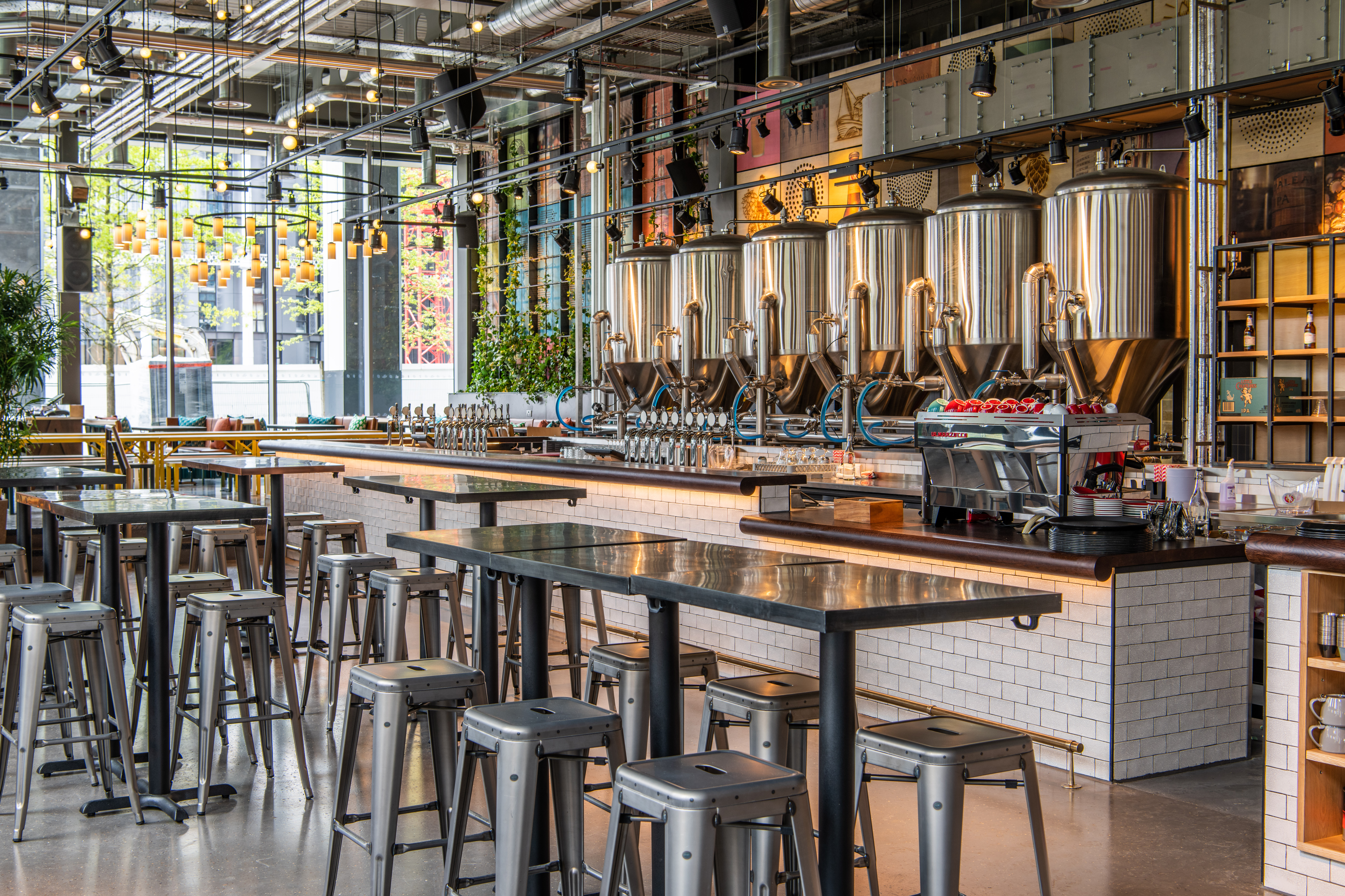 Modern industrial bar at Babel Beerhouse, perfect for networking events and gatherings. - Banner