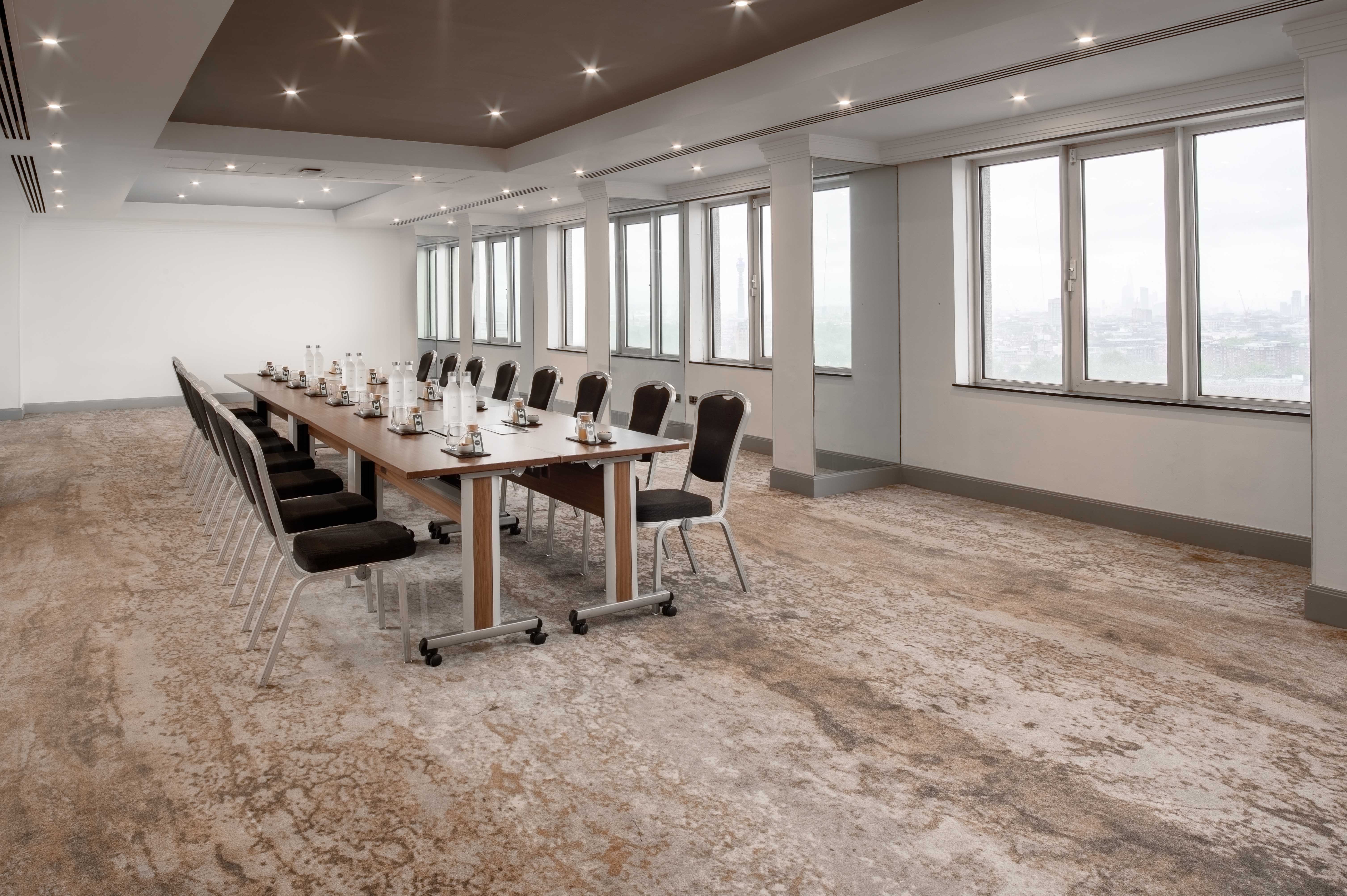Modern meeting room in Hilton London Metropole, ideal for conferences and workshops.