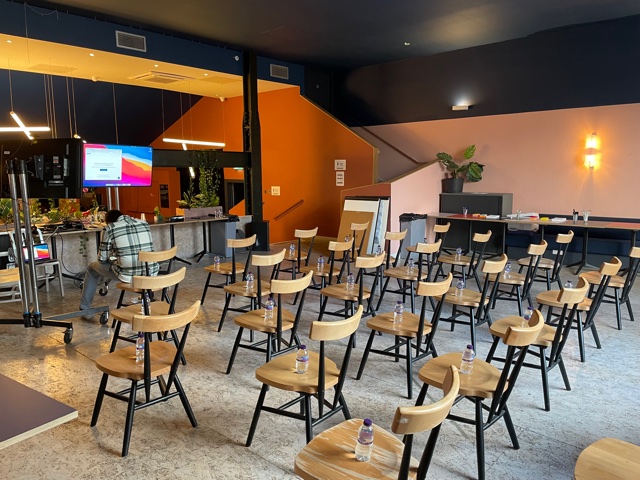 Versatile event space at Bar + Kitchen, modern chairs for meetings, ideal for workshops.