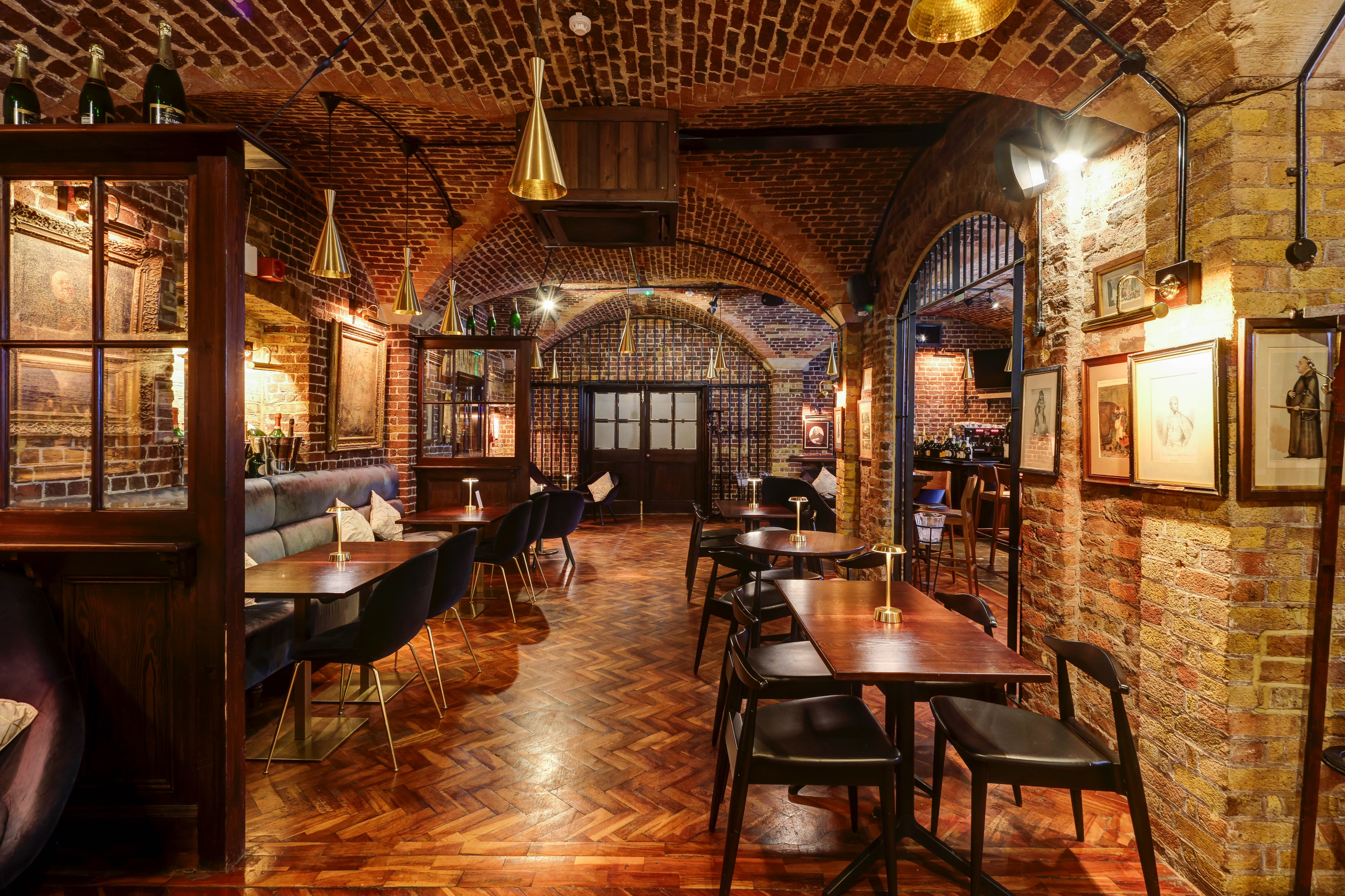 Champagne Bar at 116 Pall Mall: rustic venue with exposed brick for events and gatherings.