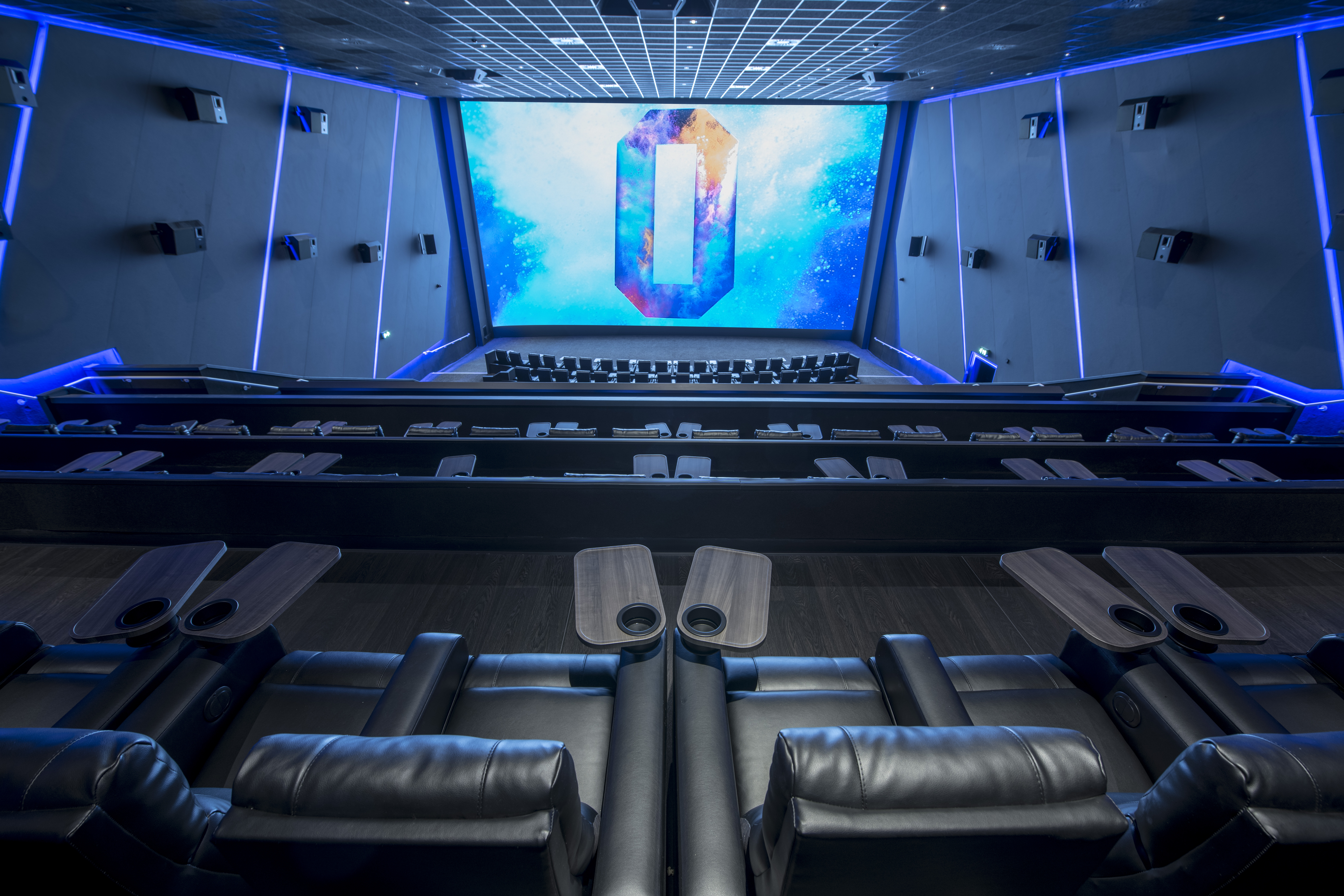 Modern cinema auditorium with plush reclining seats for film screenings and events.