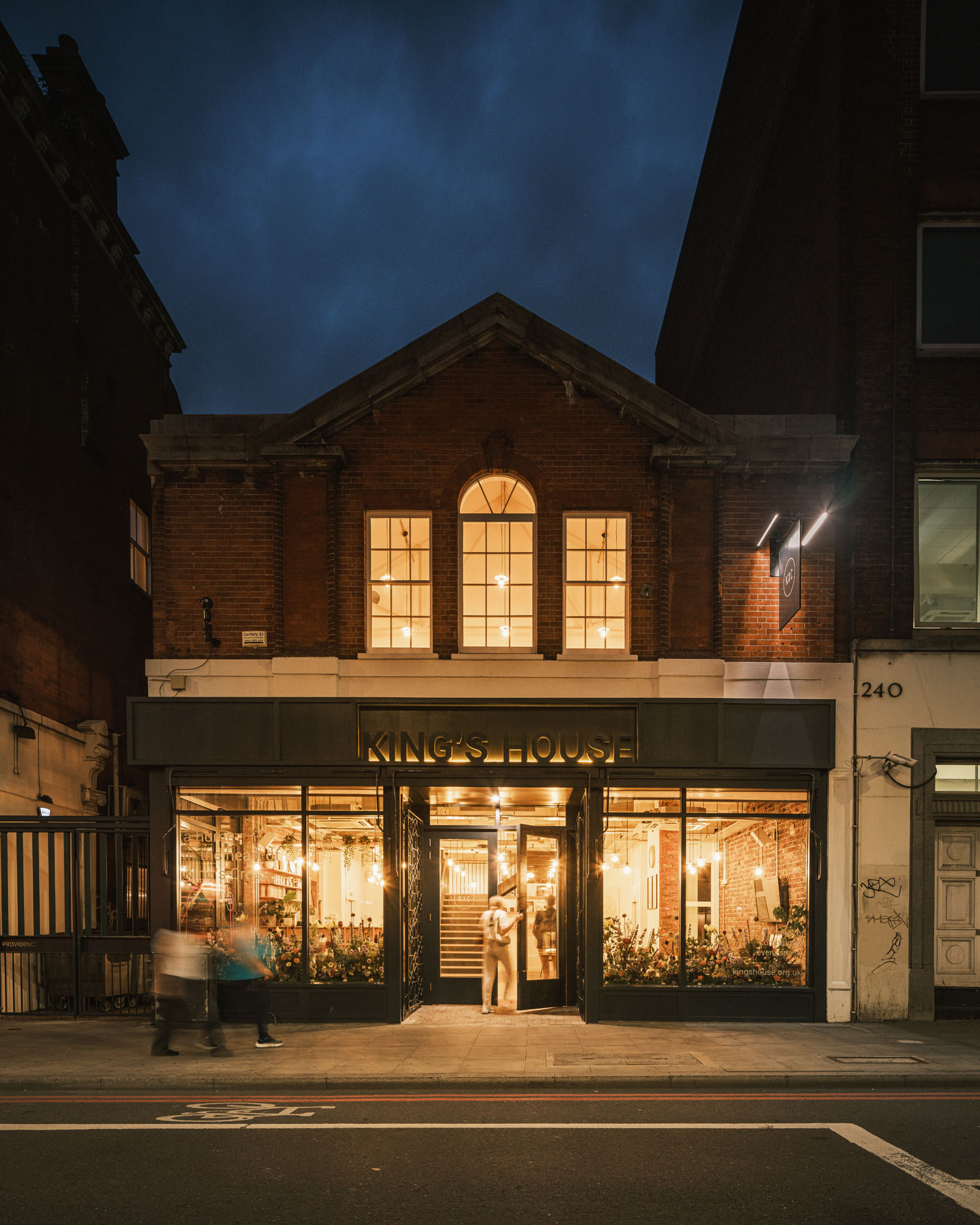 Charming King's House venue with warm lighting, ideal for corporate events and gatherings. - Banner