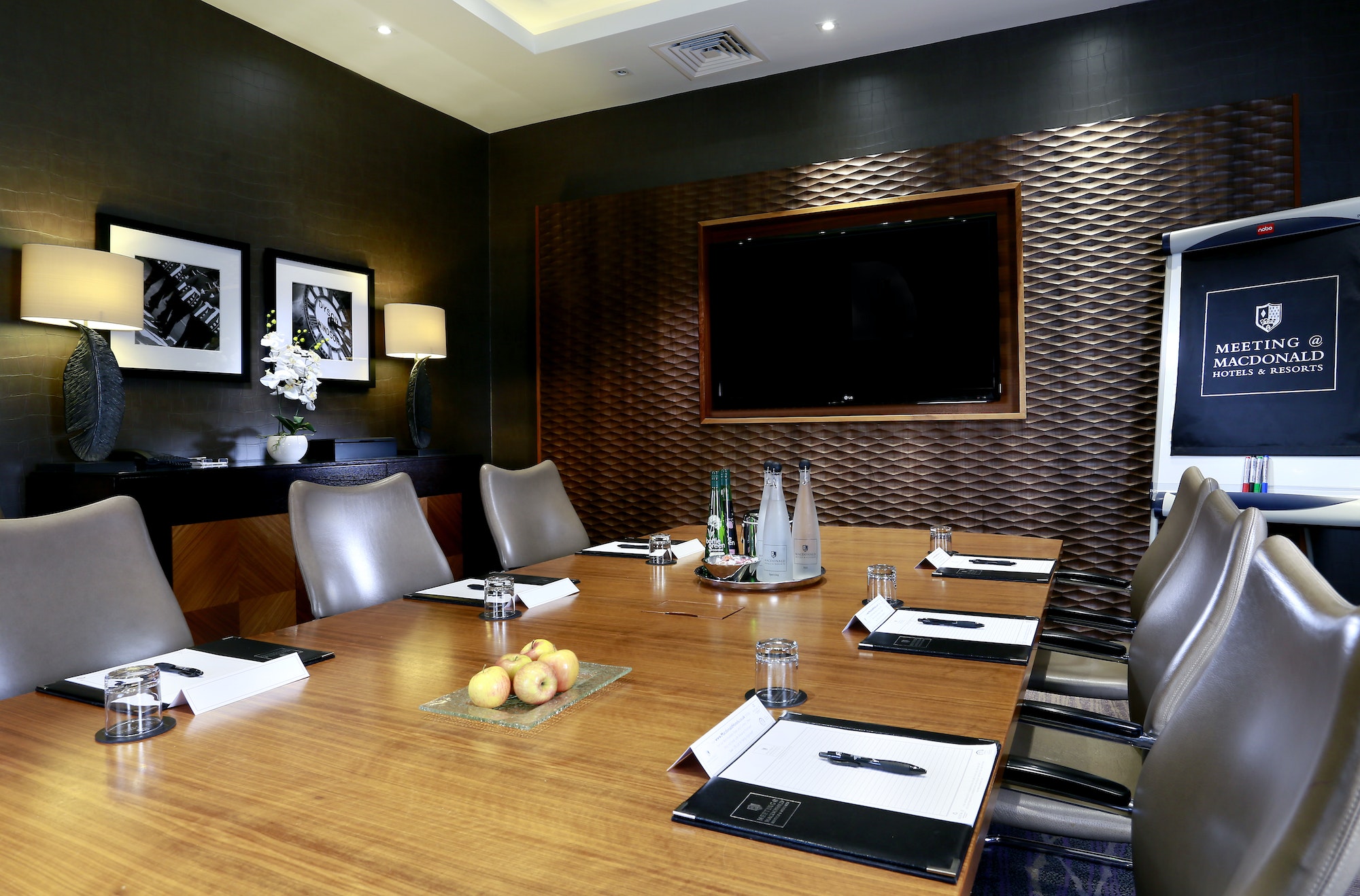 Caley's Brasserie meeting room with sleek table, ideal for professional events. - Banner