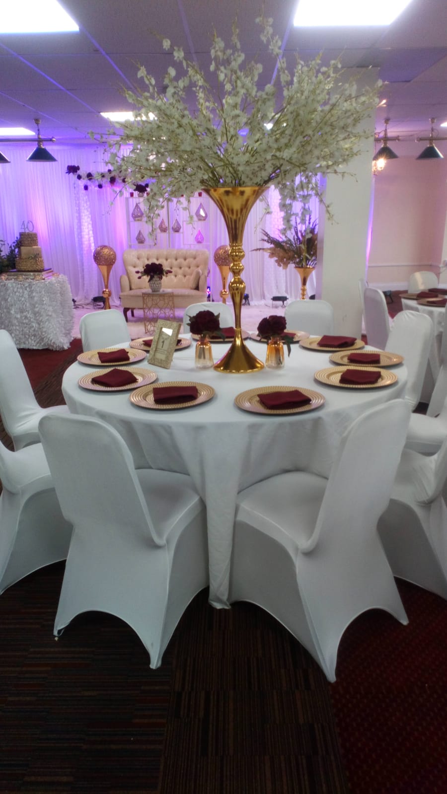 Elegant round table setup with gold accents for weddings and upscale events. - Banner