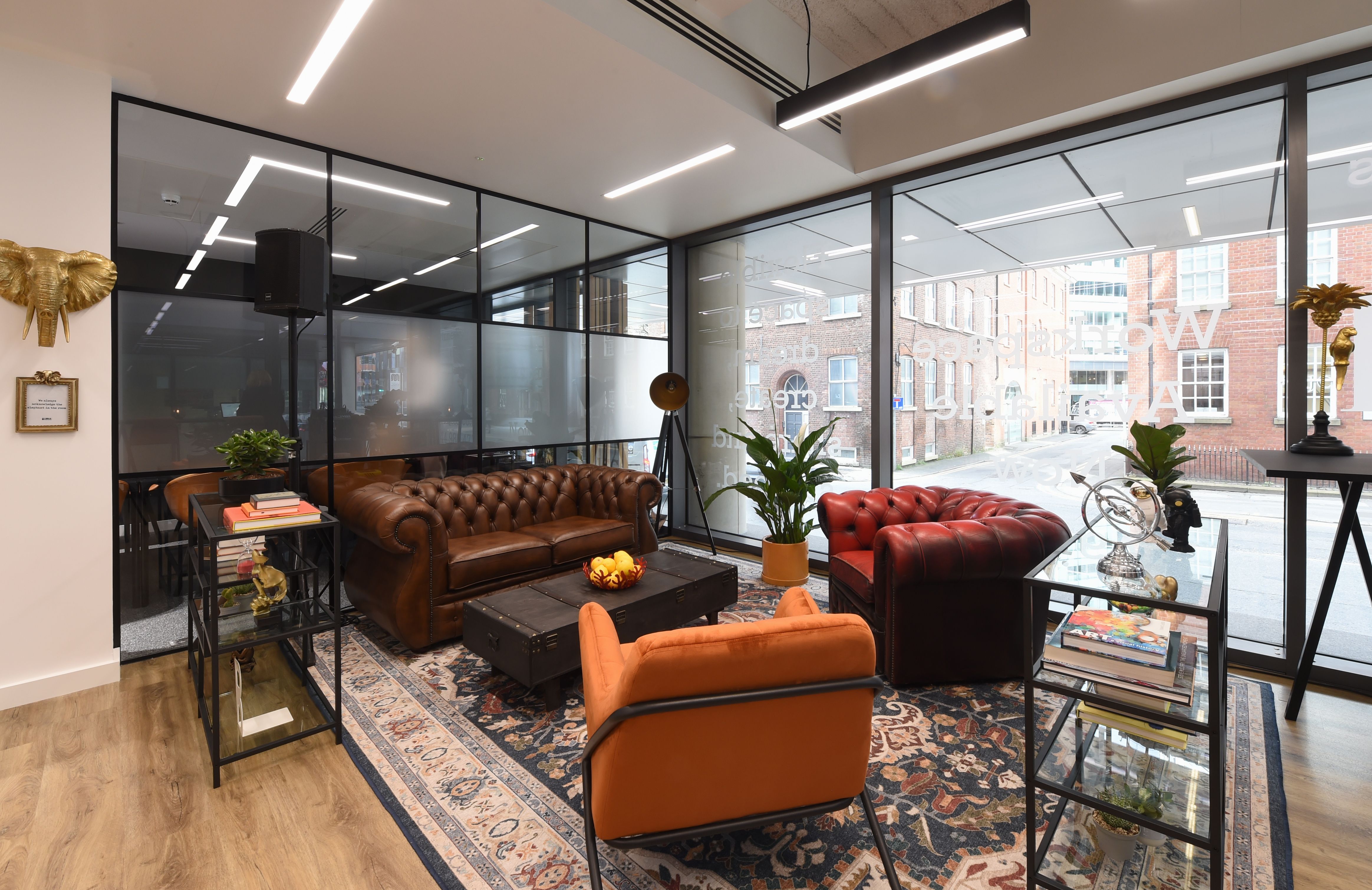 Stylish Bold Members Lounge with leather seating, ideal for networking events and meetings. - Banner