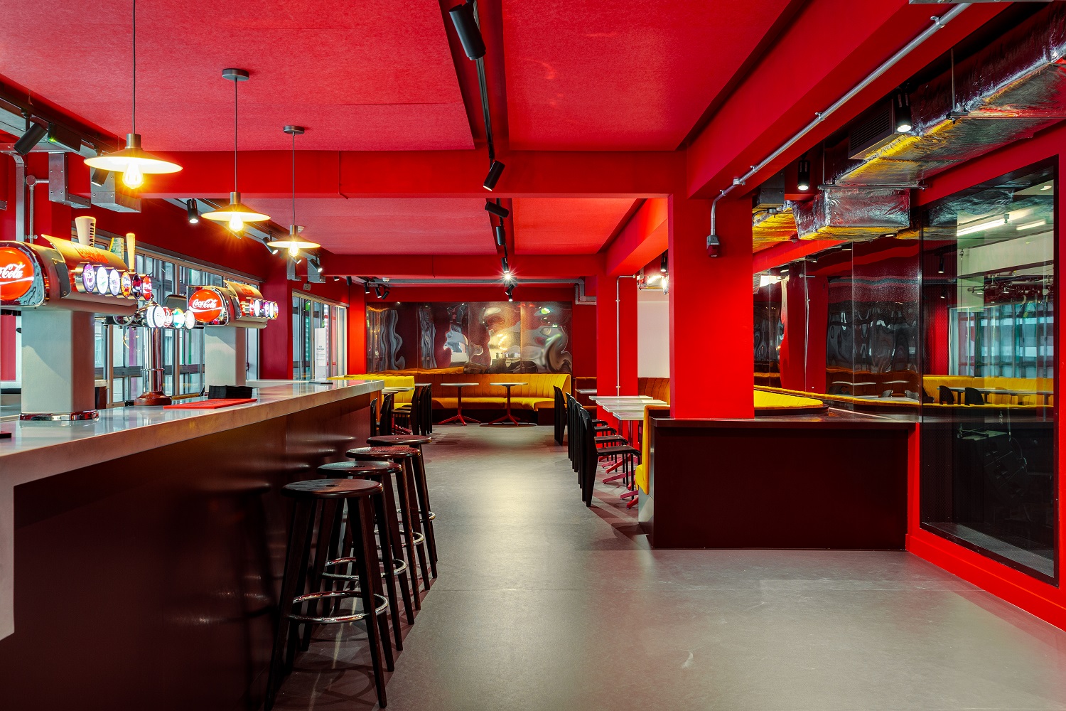 Vibrant Cinema Bar in Rich Mix, ideal for networking events with bold red walls.