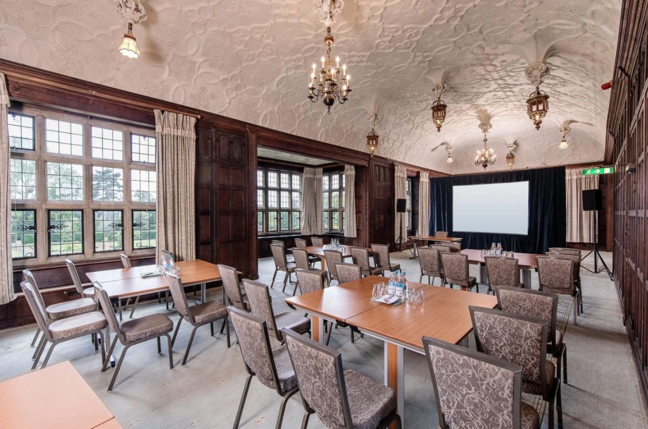 Fanhams Hall meeting room with classic architecture, ideal for corporate events and workshops. - Banner