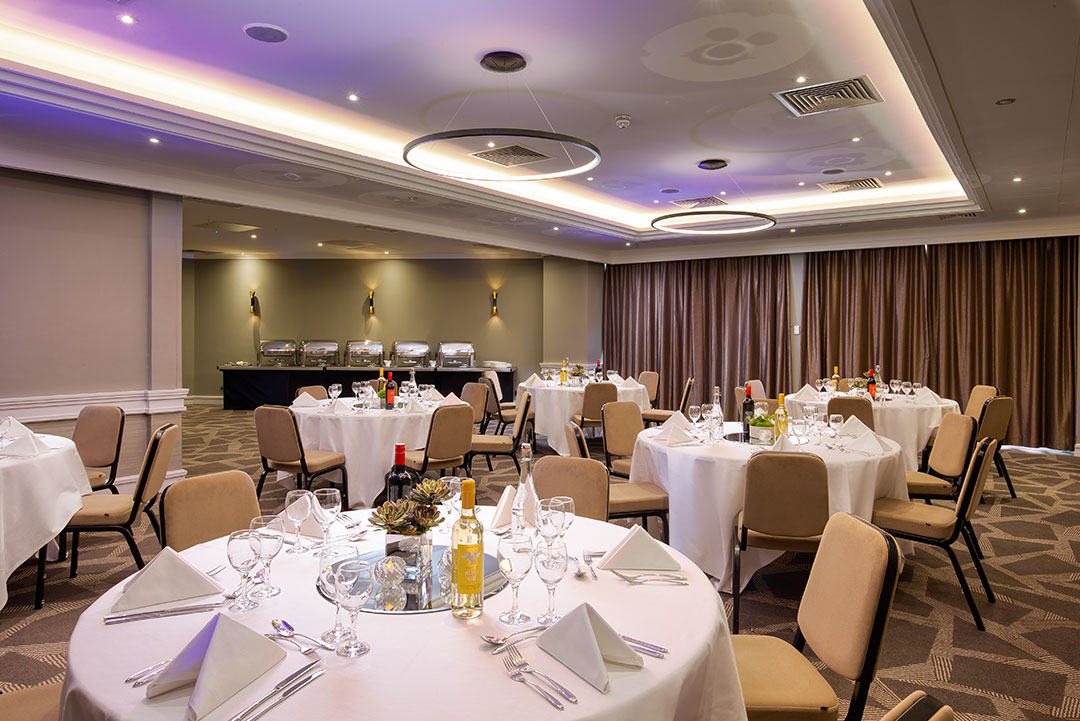 Byron Suite at DoubleTree London Ealing, elegant dinner setup for corporate events. - Banner