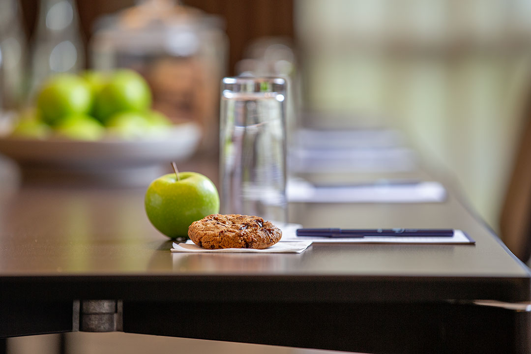 Chambers Suite meeting setup with organized table, refreshments for corporate events.