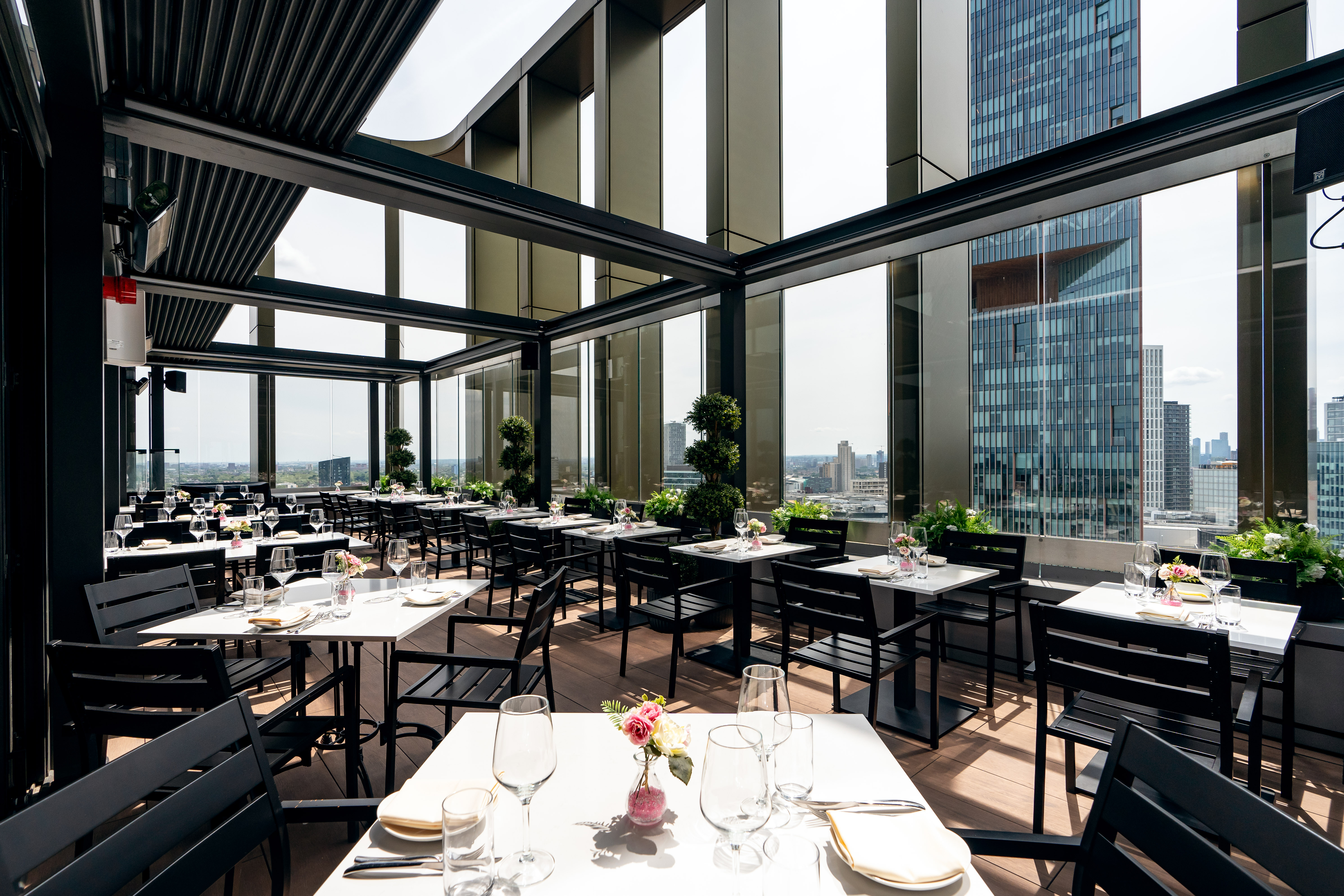 Private dining room terrace at STK Rooftop Stratford with city views, ideal for events.